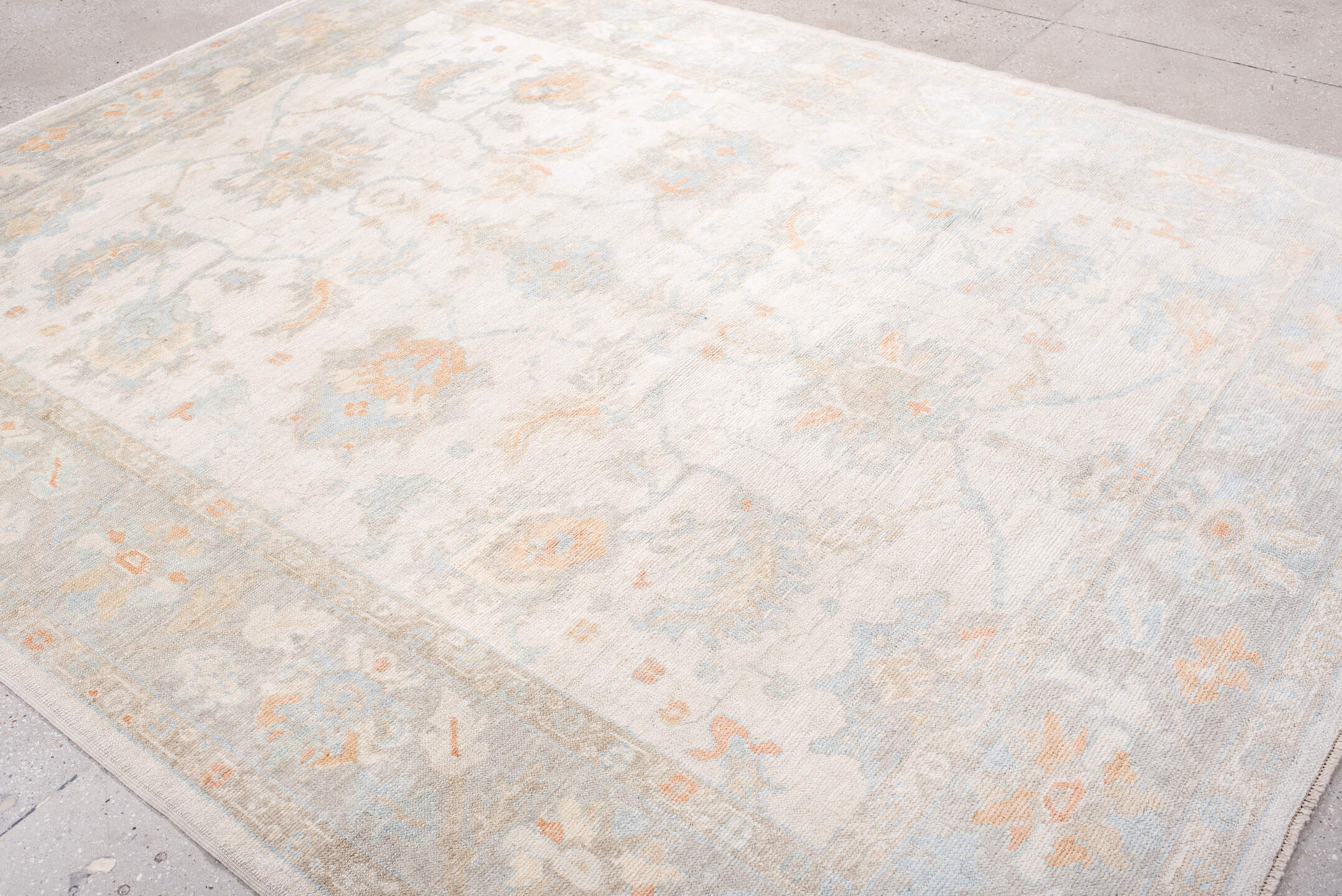 8' x 10' one-of-a-kind handmade vintage Oushak large size rug. Color palette: ivory, pale blue, blush, cream, taupe, peach