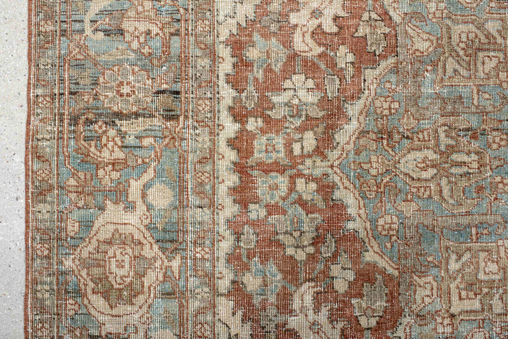 7' x 9' one-of-a-kind handmade antique Heriz rug. Color palette: ivory, sky blue, rust, taupe, camel, brown, light blue