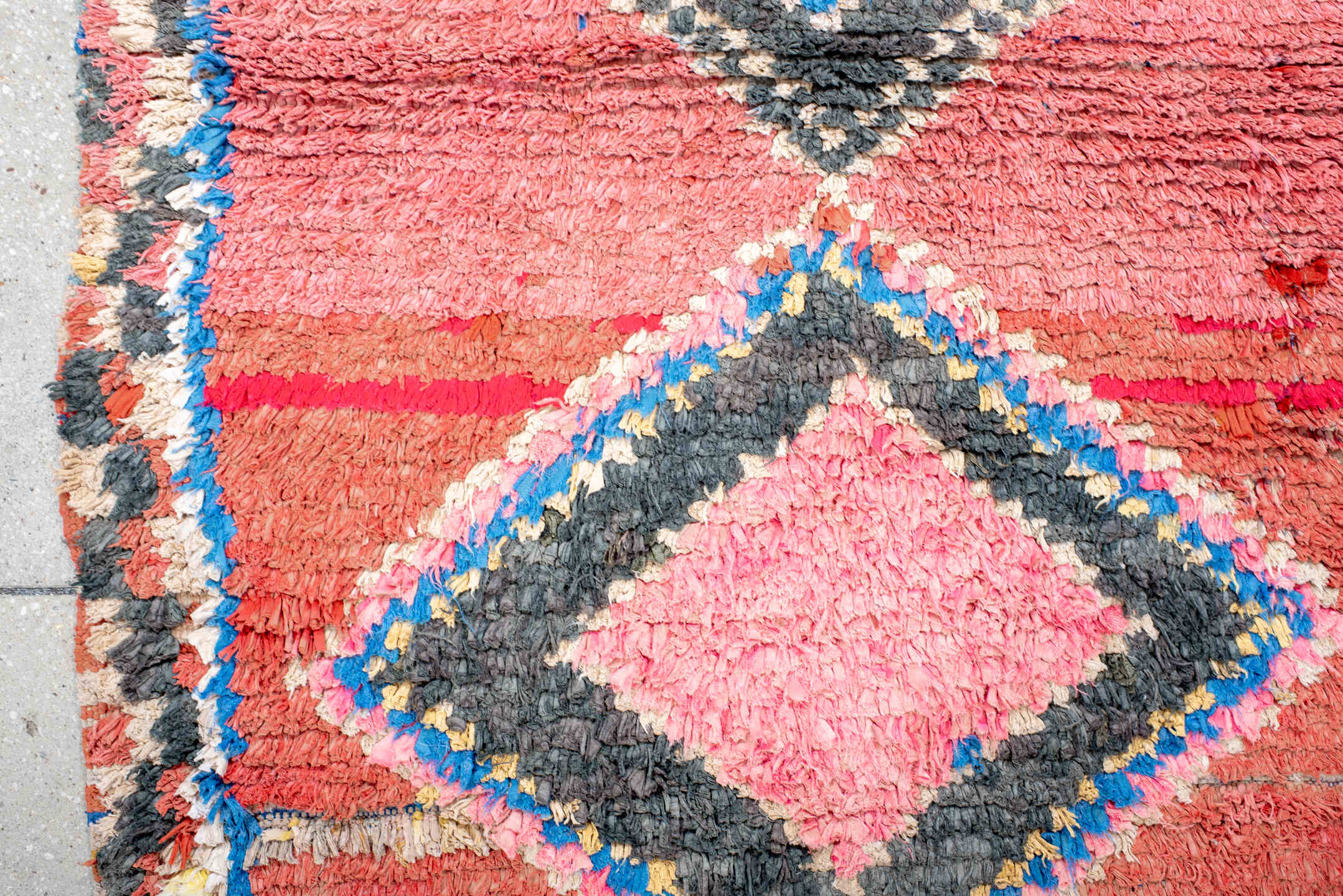 3' x 4' one-of-a-kind handmade vintage Rag Rug small size rug. Color palette: rose, charcoal, ivory, electric blue, coral
