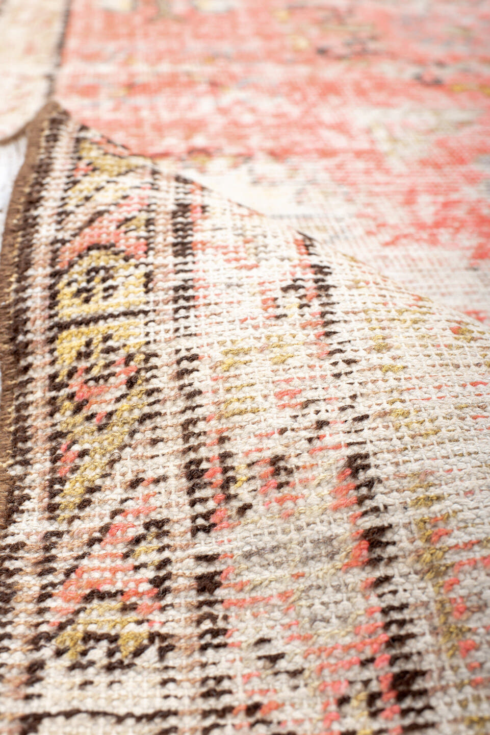 3' x 7' one-of-a-kind handmade antique Khotan rug. Color palette: ivory, coral, peach, taupe, brown, gold, charcoal