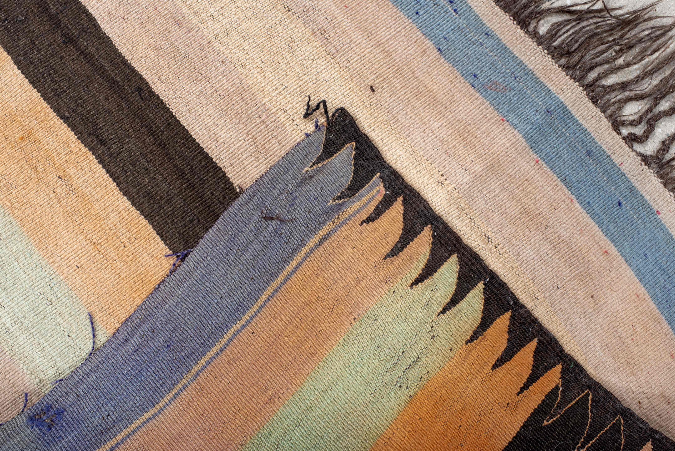 2' x 6' one-of-a-kind handmade vintage runner rug. Color palette: ivory, pale blue, peach, brown, cream, charcoal, lavender
