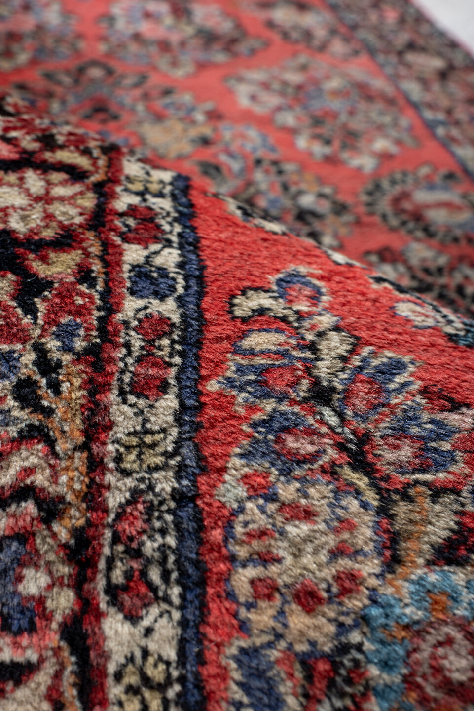 2' x 6' one-of-a-kind handmade antique Sarouk runner rug. Color palette: red, navy, ivory, rose, slate, burgundy, camel