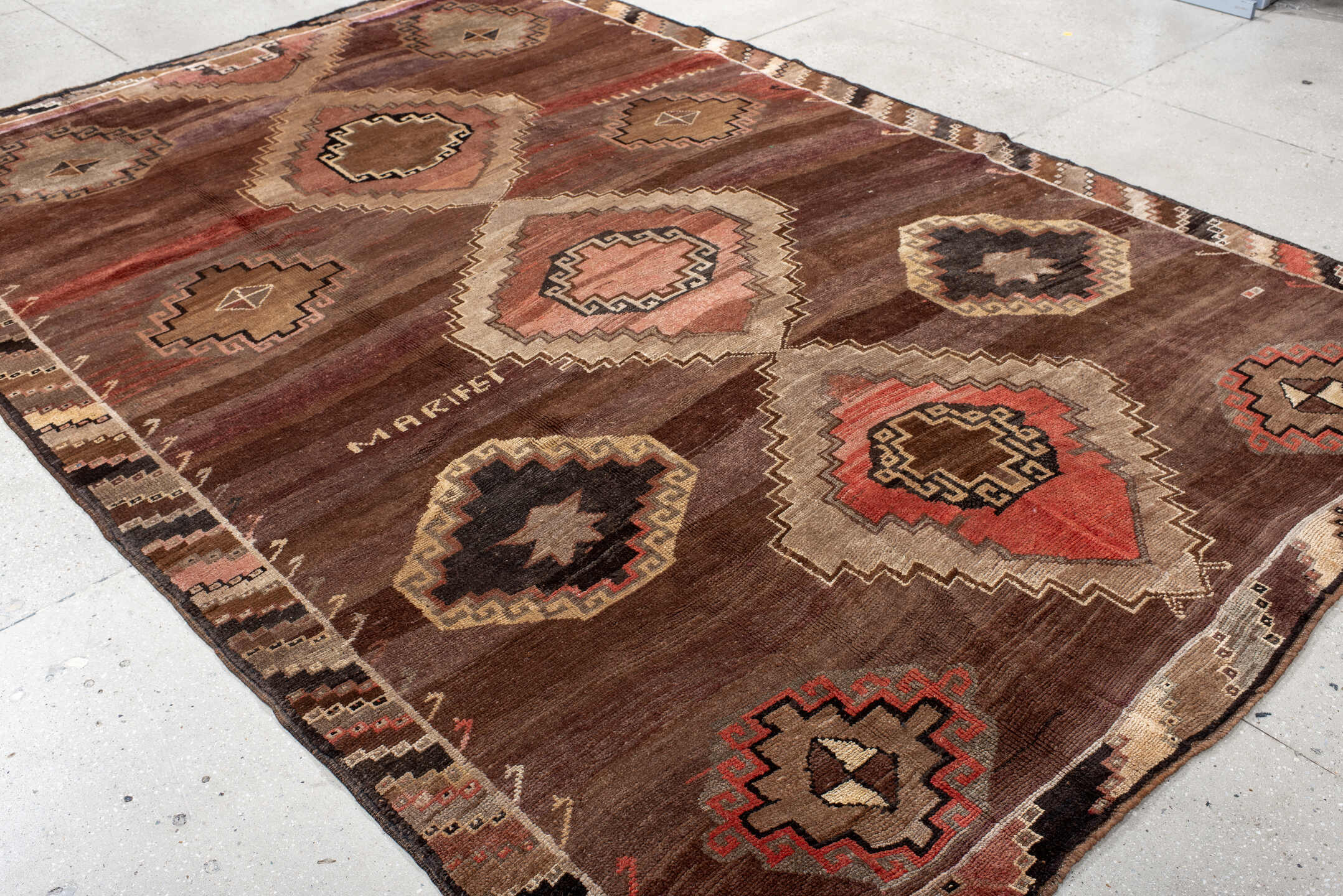 7' x 11' one-of-a-kind handmade vintage Kars large size rug. Color palette: brown, gray, maroon, off-white, orange, pink