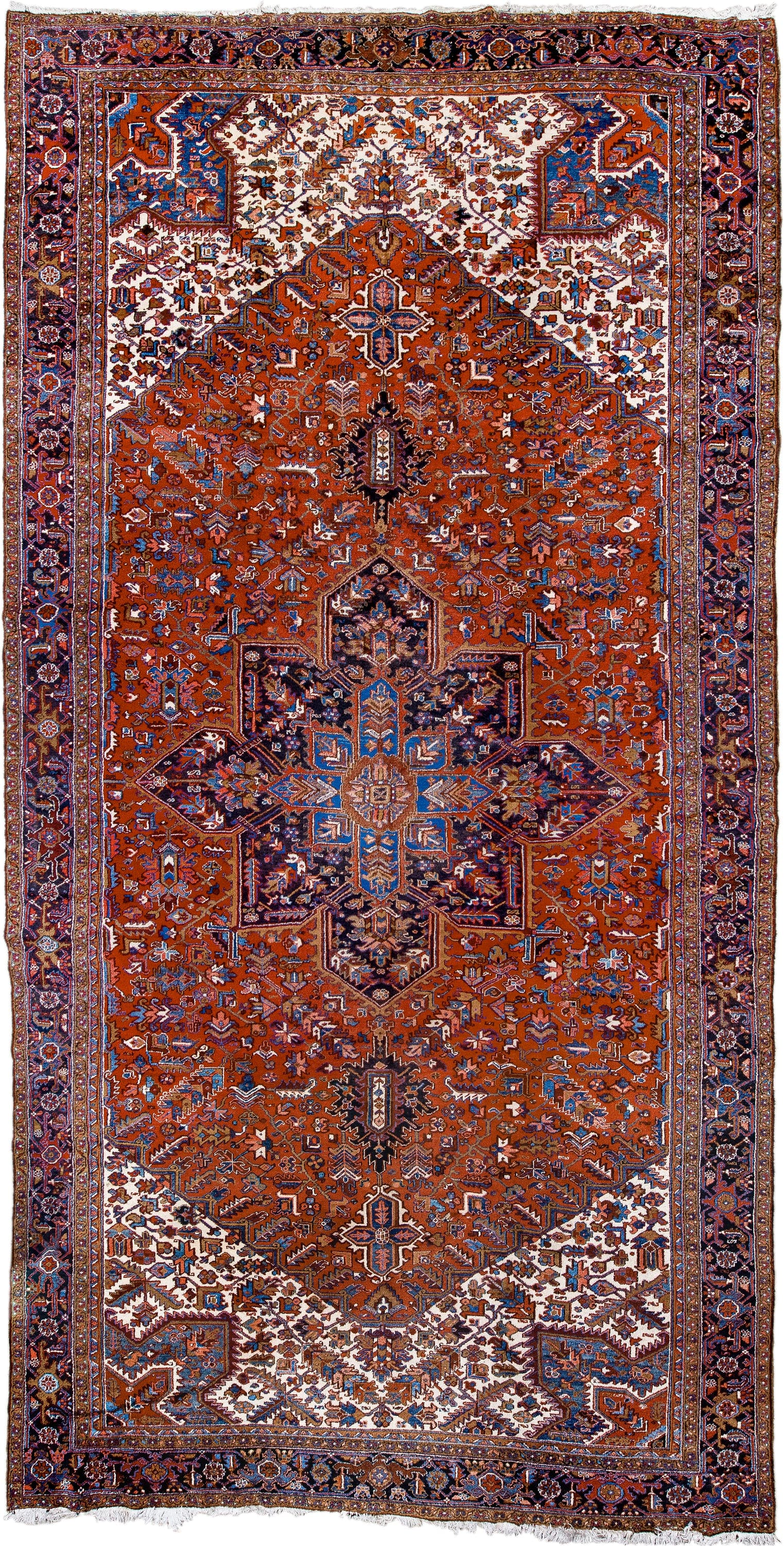 11' x 21' one-of-a-kind handmade antique Heriz oversize rug. Color palette: rust, ivory, navy, cobalt, terra cotta, charcoal