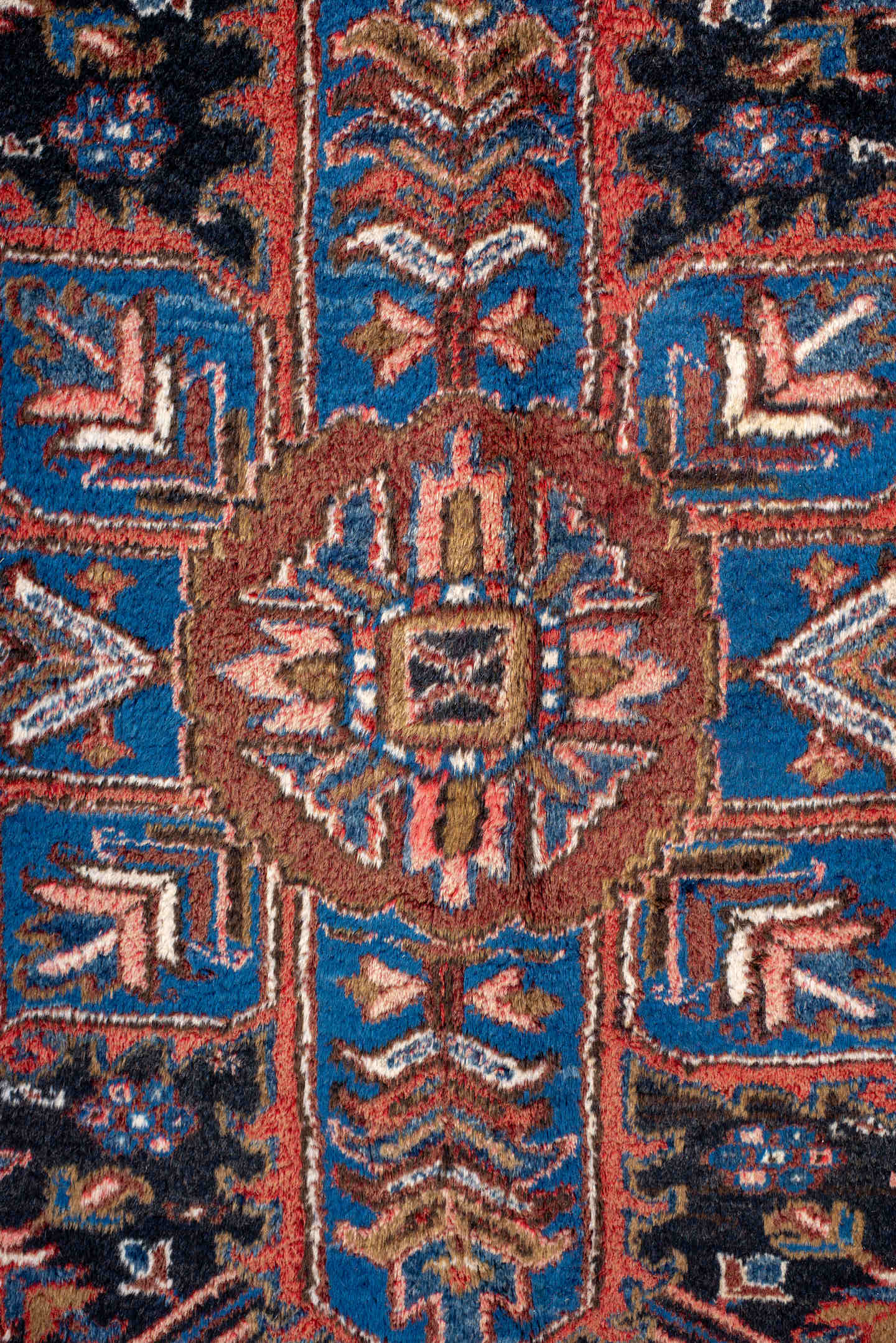 11' x 21' one-of-a-kind handmade antique Heriz oversize rug. Color palette: rust, ivory, navy, cobalt, terra cotta, charcoal