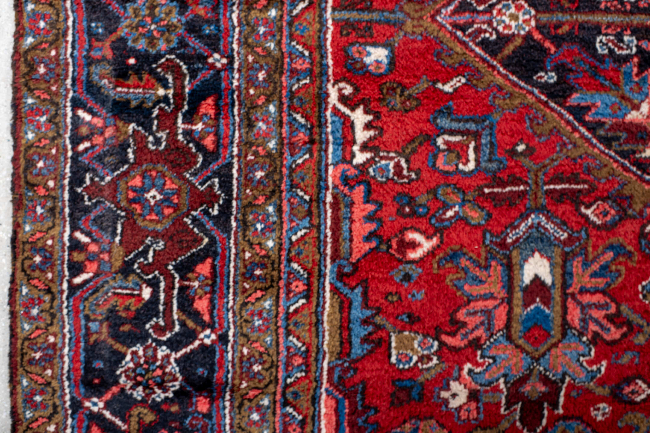 11' x 21' one-of-a-kind handmade antique Heriz oversize rug. Color palette: rust, ivory, navy, cobalt, terra cotta, charcoal