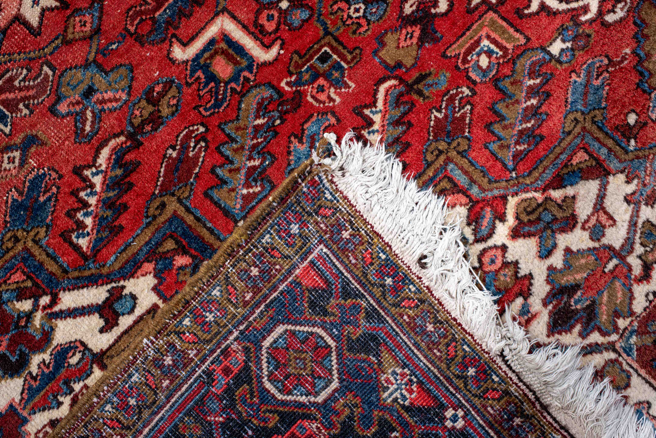 11' x 21' one-of-a-kind handmade antique Heriz oversize rug. Color palette: rust, ivory, navy, cobalt, terra cotta, charcoal