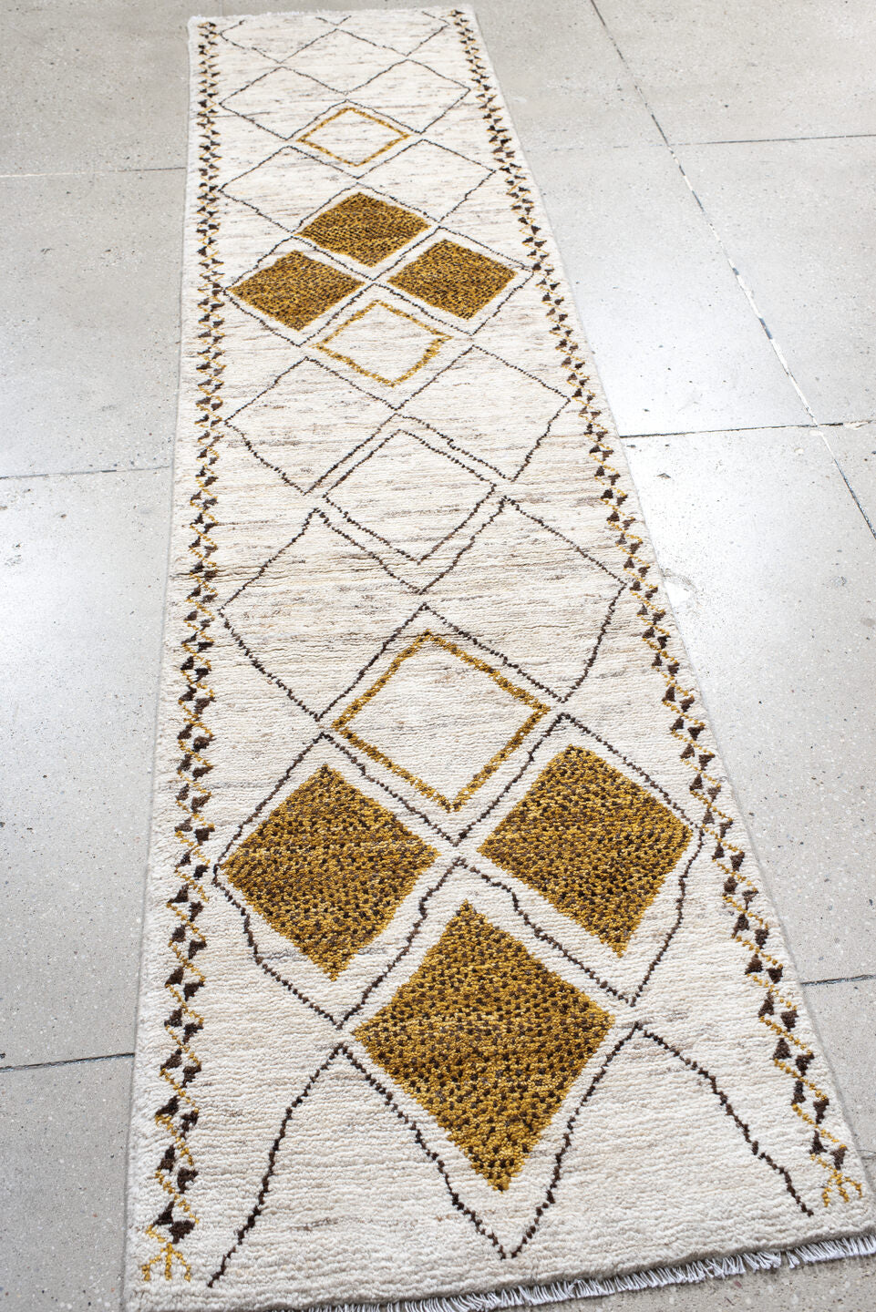 2' x 9' one-of-a-kind handmade vintage Moroccan runner rug. Color palette: ivory, ochre, charcoal, taupe, gold, brown, gray