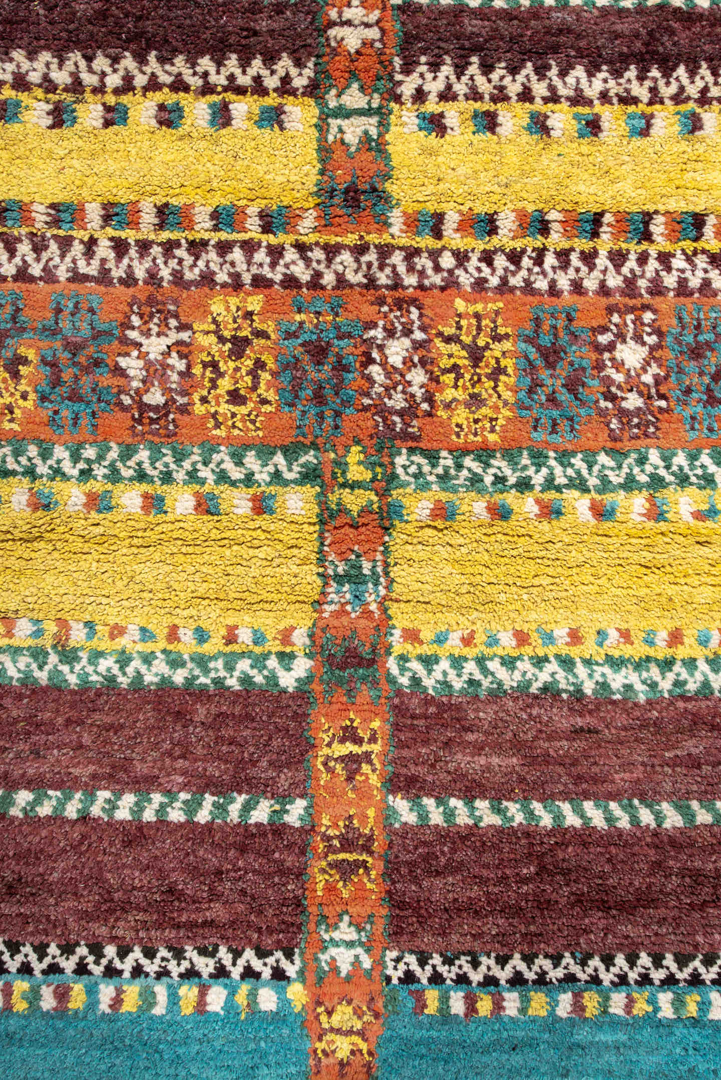 3' x 6' one-of-a-kind handmade vintage Moroccan small size rug. Color palette: orange, brown, turquoise, yellow, green