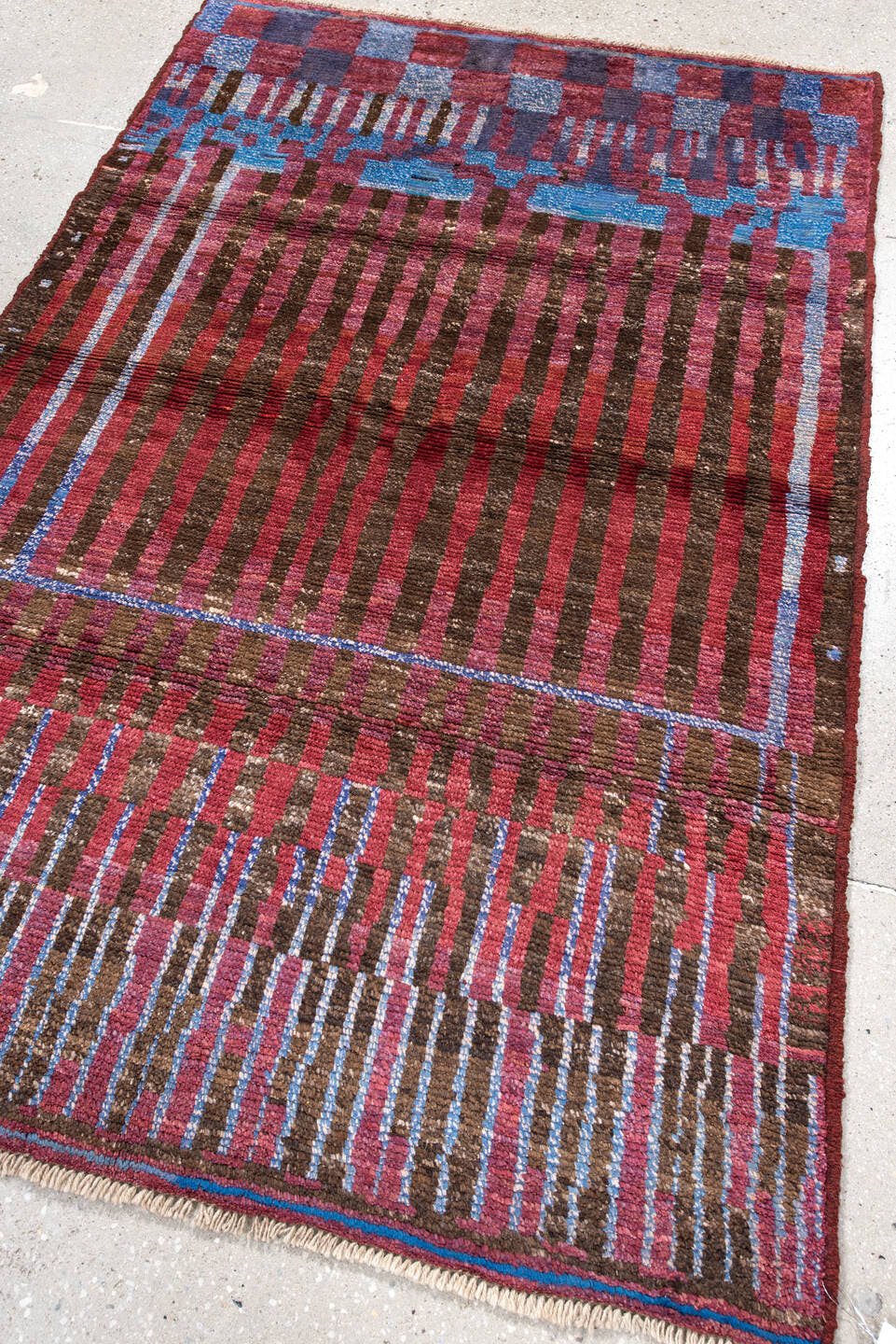 3' x 5' one-of-a-kind handmade vintage Moroccan small size rug. Color palette: brown, crimson, rose, sky blue, burgundy