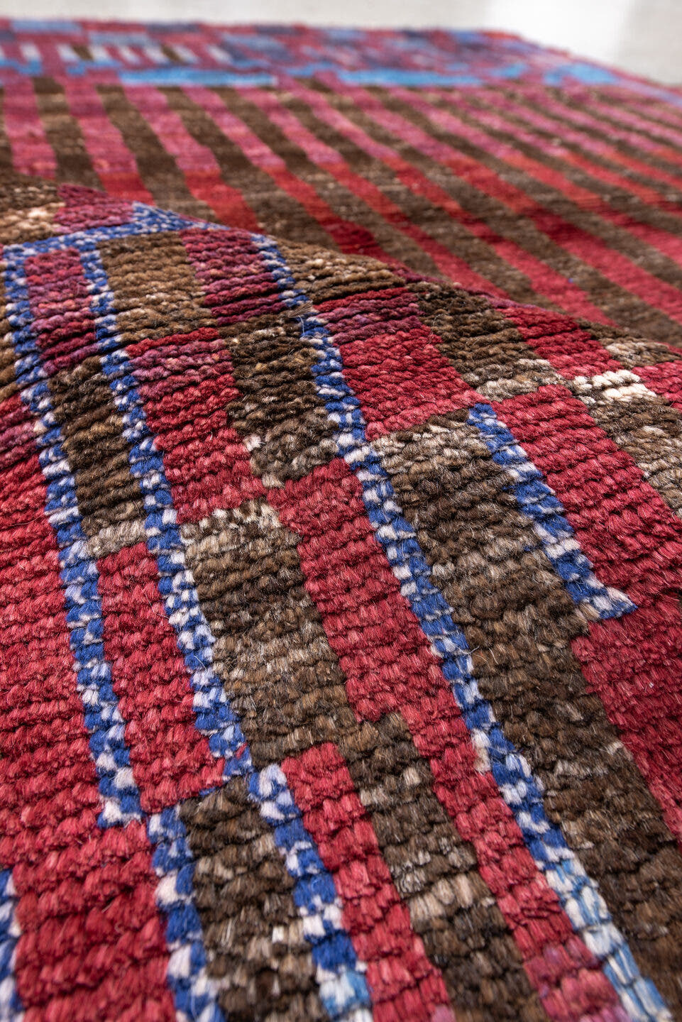 3' x 5' one-of-a-kind handmade vintage Moroccan small size rug. Color palette: brown, crimson, rose, sky blue, burgundy