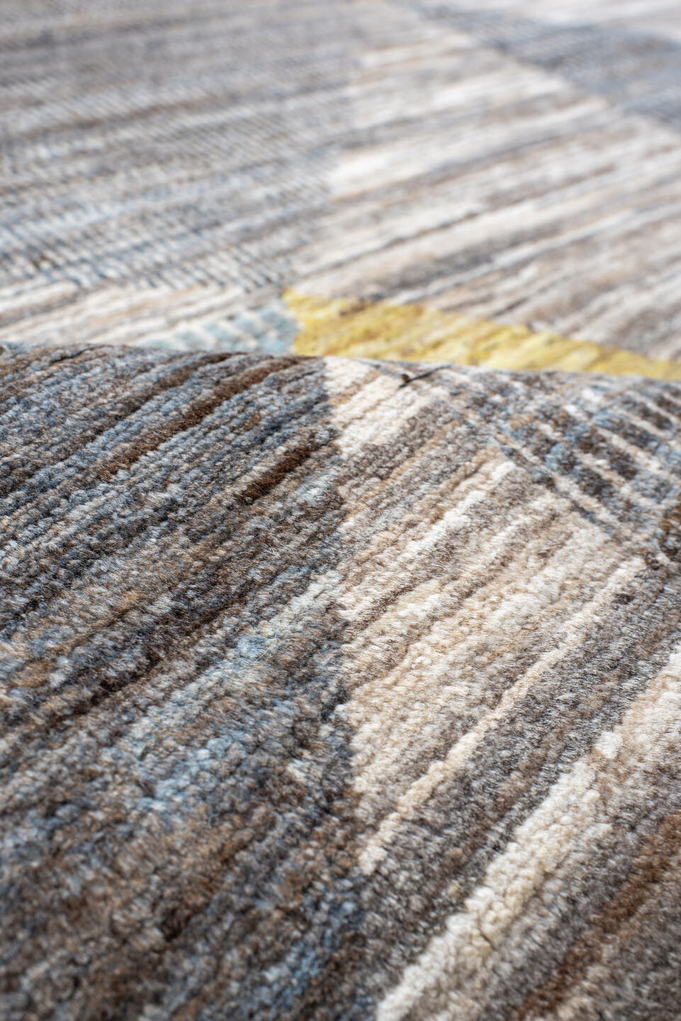 7' x 9' one-of-a-kind handmade handmade Modern rug. Color palette: gray, ivory, gold, light blue, taupe, charcoal, beige