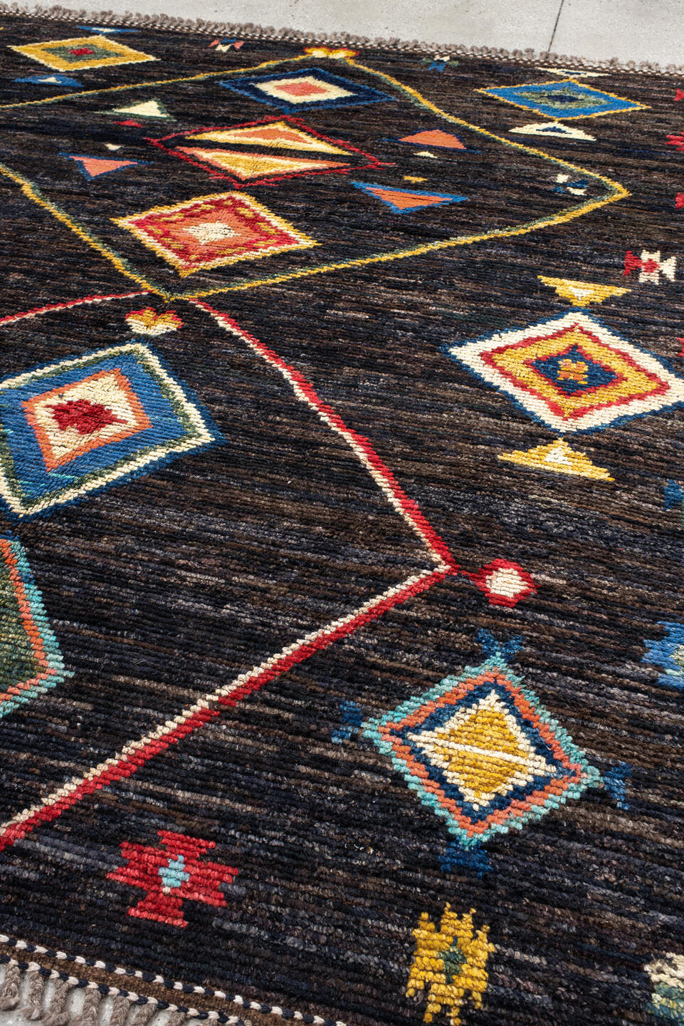 8' x 9' one-of-a-kind handmade vintage Tulu rug. Color palette: charcoal, brown, sky blue, ivory, rust, gold, coral, sage