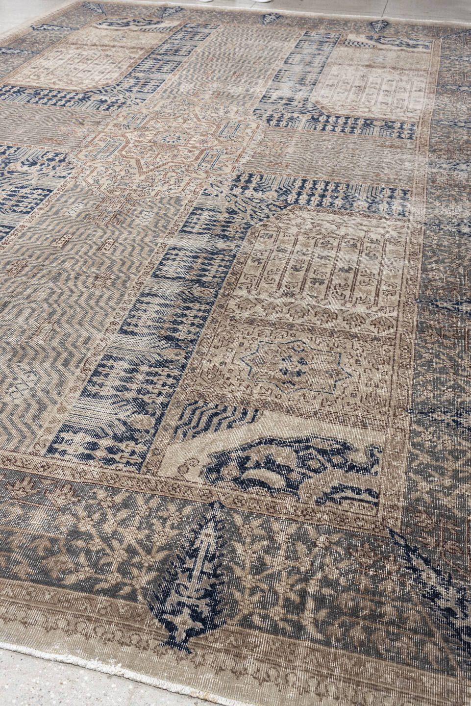 9' x 15' one-of-a-kind handmade vintage Sparta rug. Color palette: ivory, taupe, slate blue, charcoal, beige, navy, camel