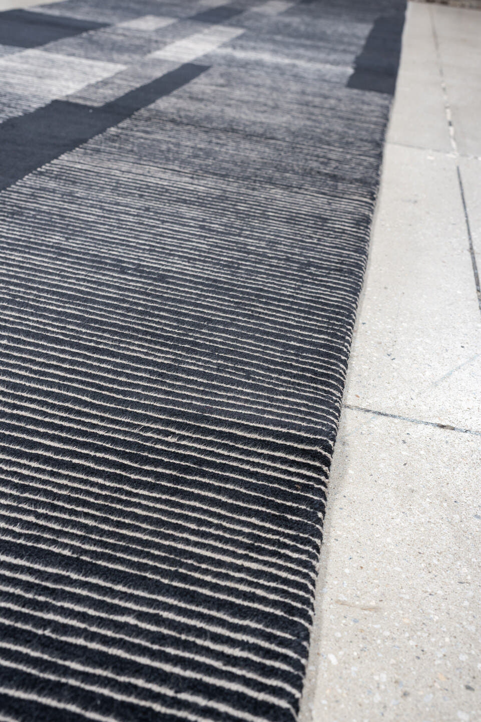 4' x 22' one-of-a-kind handmade antique Tibetan runner rug. Color palette: charcoal, slate, ivory, pewter, ebony, black