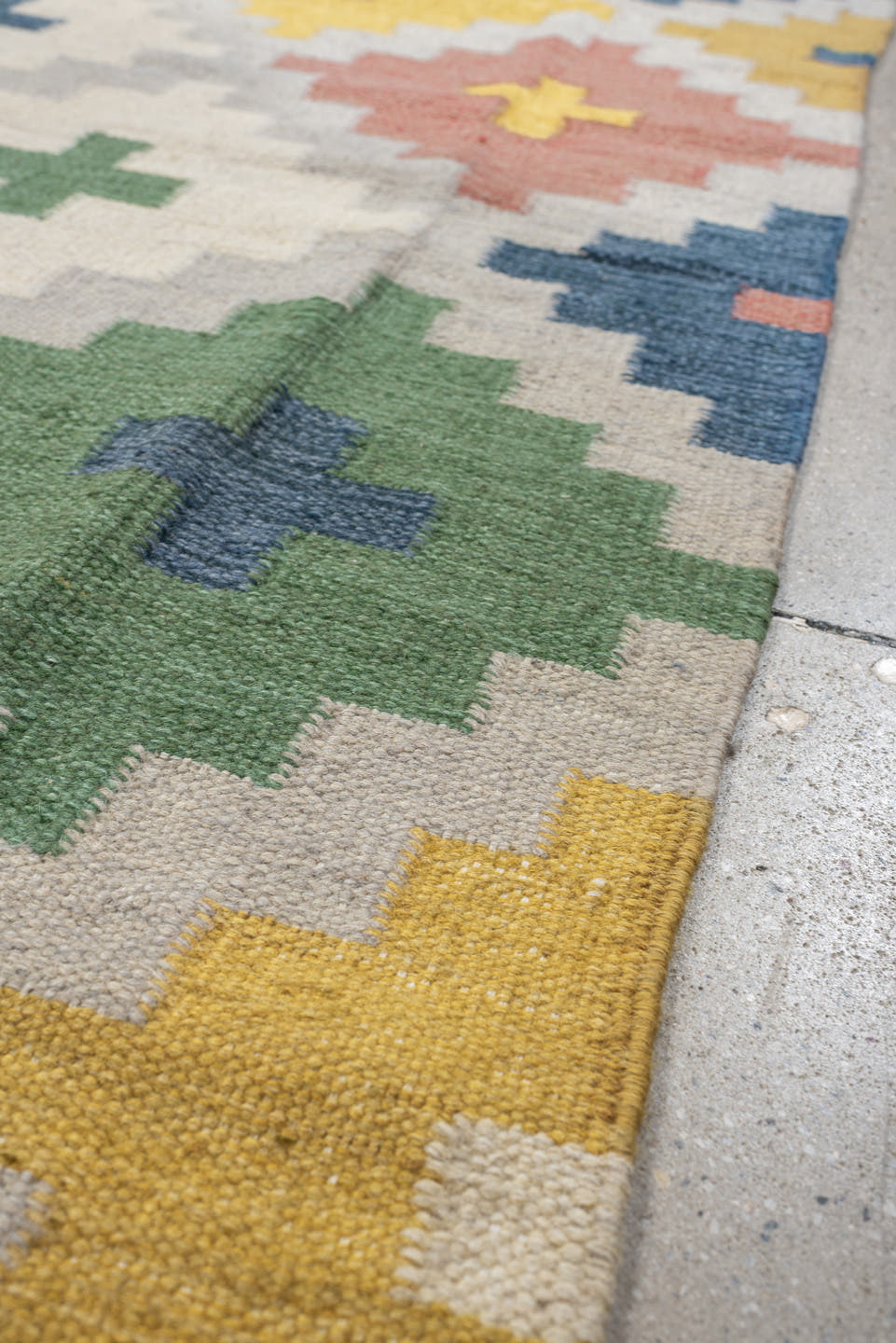 4' x 6' one-of-a-kind handmade antique Rollaken rug. Color palette: ivory, denim blue, yellow, sage green, dusty rose