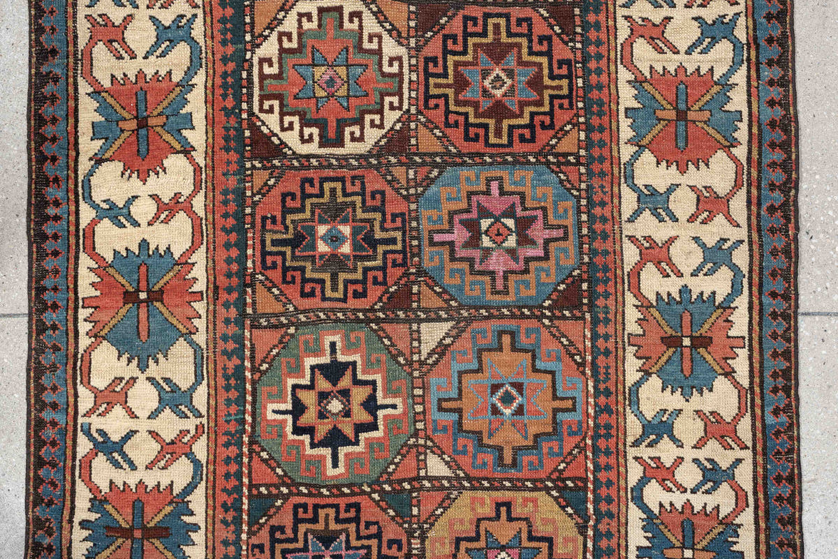3' x 13' one-of-a-kind handmade antique Caucasian runner rug. Color palette: indigo, ivory, rust, coral, teal, charcoal