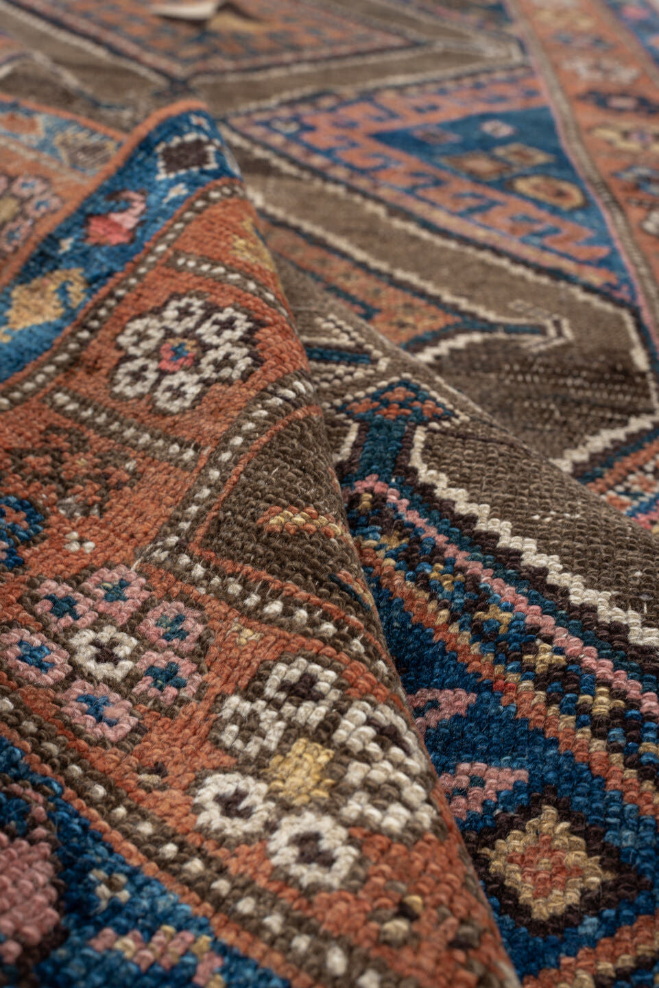 3' x 6' one-of-a-kind handmade antique Kurd runner rug. Color palette: teal blue, camel, rose, ivory, brown, navy, salmon