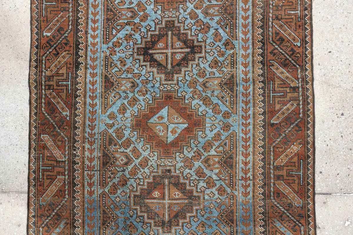 2' x 4' one-of-a-kind handmade antique Belouch small size rug. Color palette: rust, pale blue, camel, dark brown, ivory