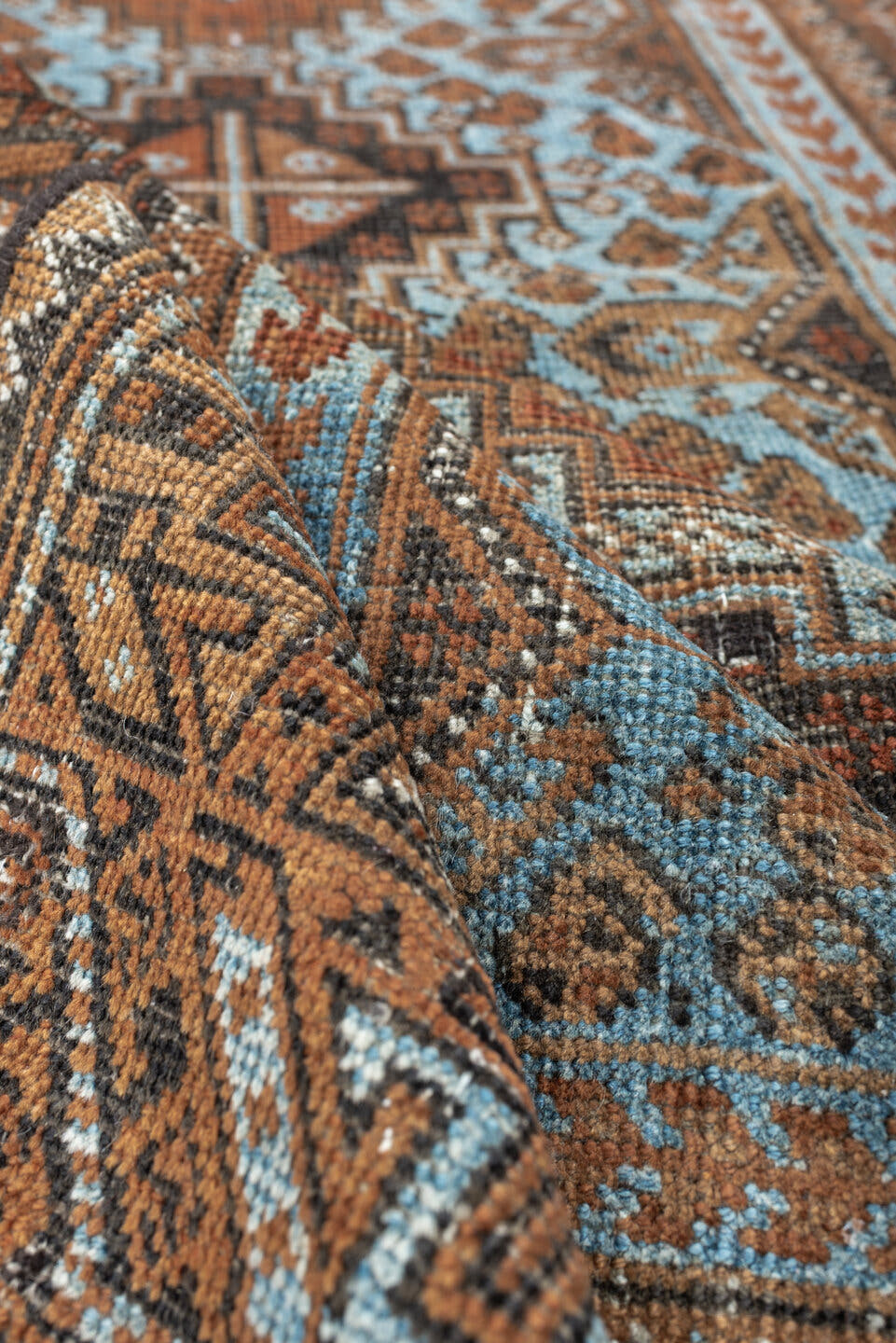 2' x 4' one-of-a-kind handmade antique Belouch small size rug. Color palette: rust, pale blue, camel, dark brown, ivory