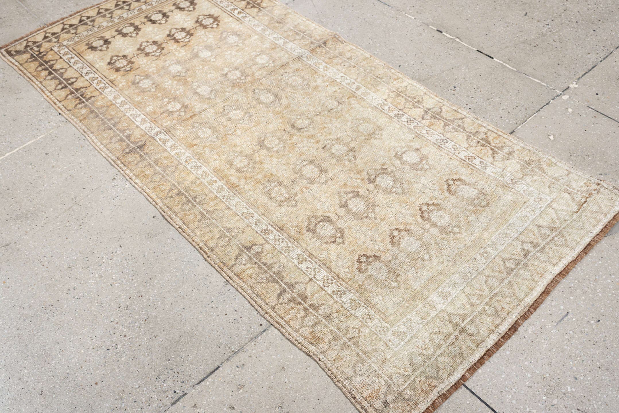 2' x 6' one-of-a-kind handmade antique Caucasian runner rug. Color palette: ivory, beige, taupe, brown, camel, gray