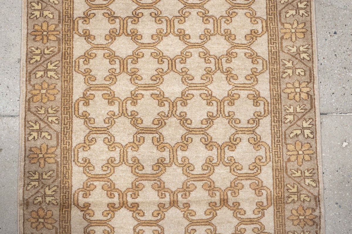 2' x 10' one-of-a-kind handmade antique Khotan runner rug. Color palette: ivory, taupe, beige, pale peach, camel, gray