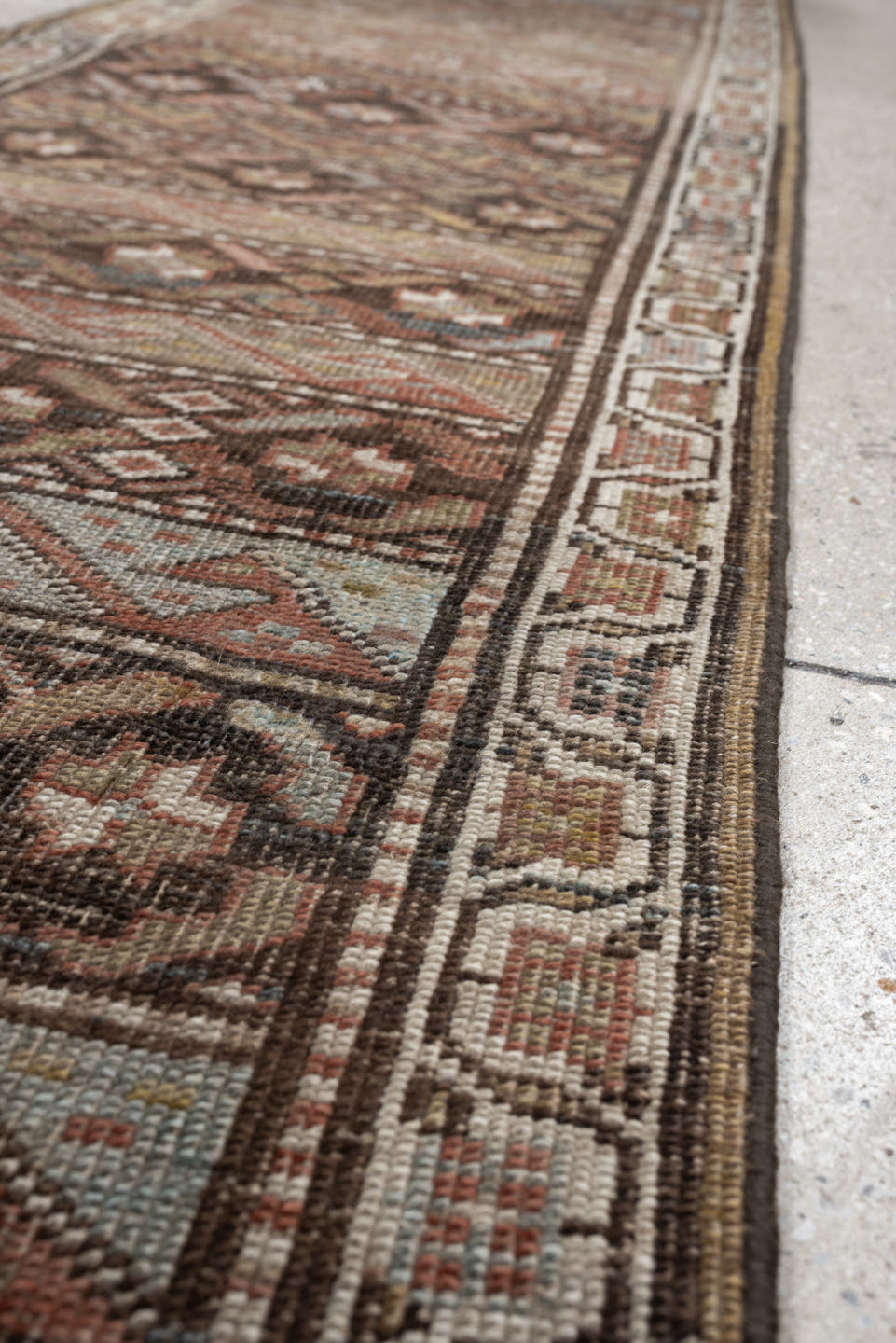 2' x 9' one-of-a-kind handmade antique Bidjar runner rug. Color palette: brown, ivory, rust, sky blue, taupe, camel