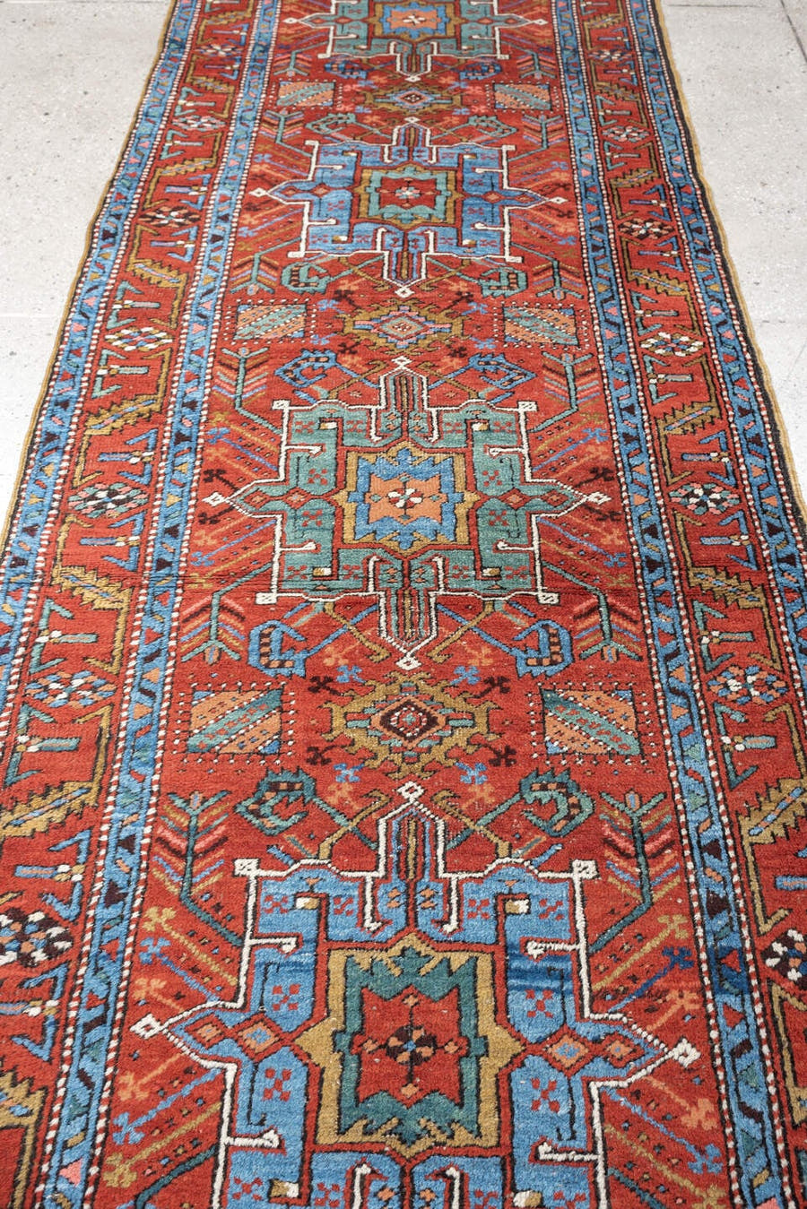 3' x 10' one-of-a-kind handmade antique Heriz runner rug. Color palette: rust, turquoise, sky blue, ivory, coral, navy, sage
