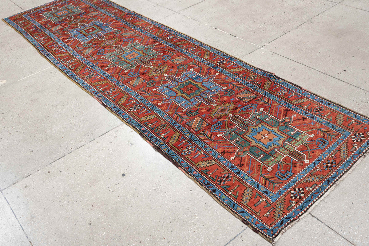 3' x 10' one-of-a-kind handmade antique Heriz runner rug. Color palette: rust, turquoise, sky blue, ivory, coral, navy, sage