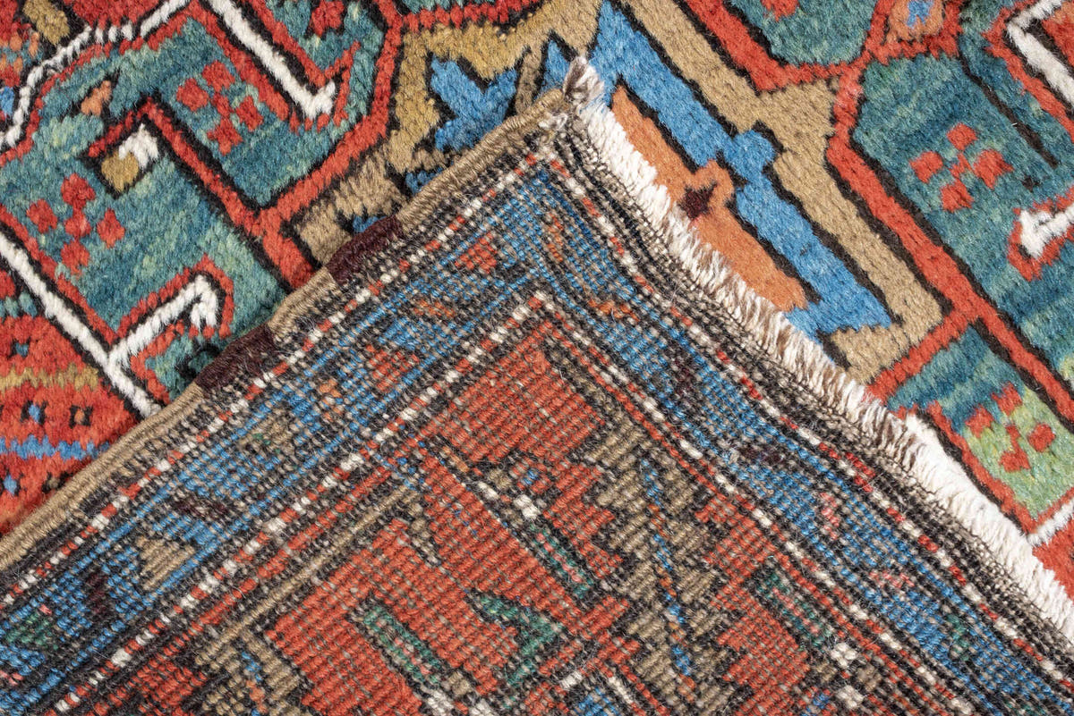 3' x 10' one-of-a-kind handmade antique Heriz runner rug. Color palette: rust, turquoise, sky blue, ivory, coral, navy, sage