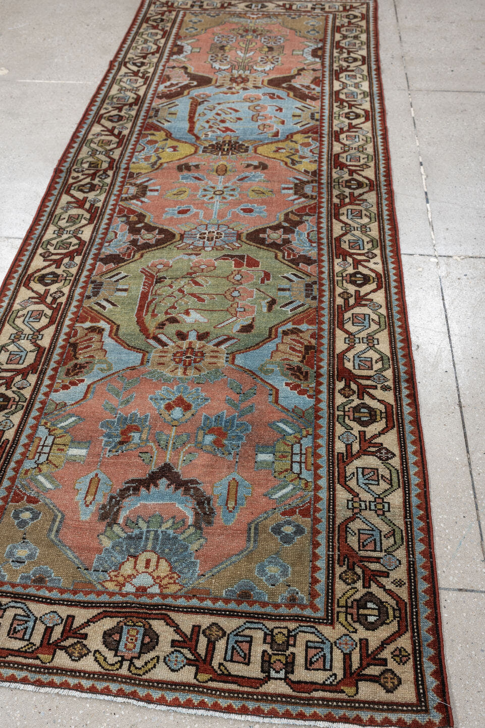 3' x 9' one-of-a-kind handmade antique Baktiary runner rug. Color palette: rose, ivory, pale blue, sage, rust, brown, taupe