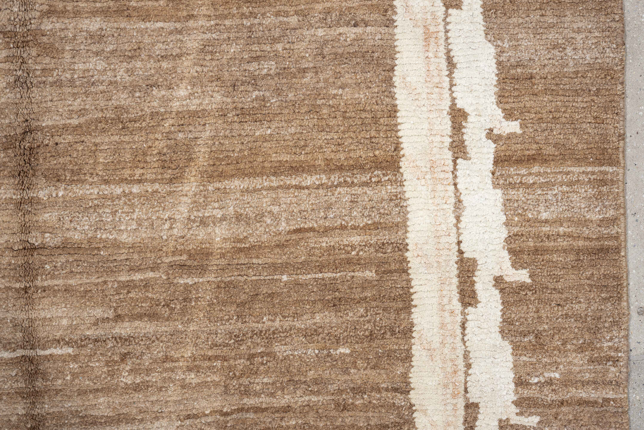 7' x 9' one-of-a-kind handmade vintage Tibetan rug. Color palette: camel, ivory, taupe, beige, cream, gray
