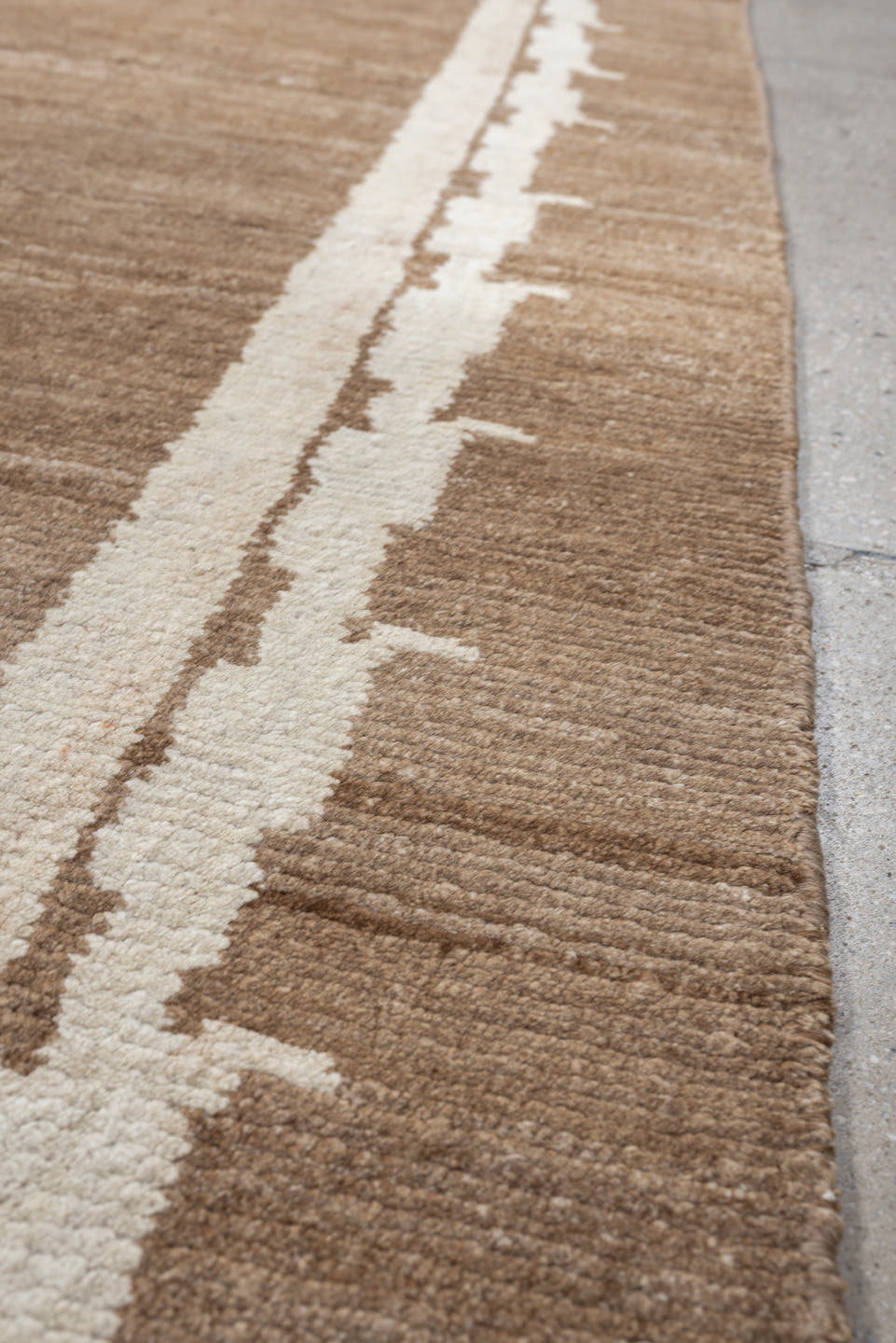 7' x 9' one-of-a-kind handmade vintage Tibetan rug. Color palette: camel, ivory, taupe, beige, cream, gray