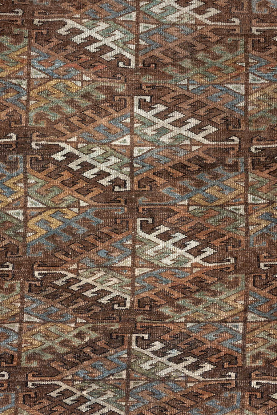 7' x 10' one-of-a-kind handmade antique Yamoud large size rug. Color palette: brown, camel, ivory, muted teal, rust, taupe