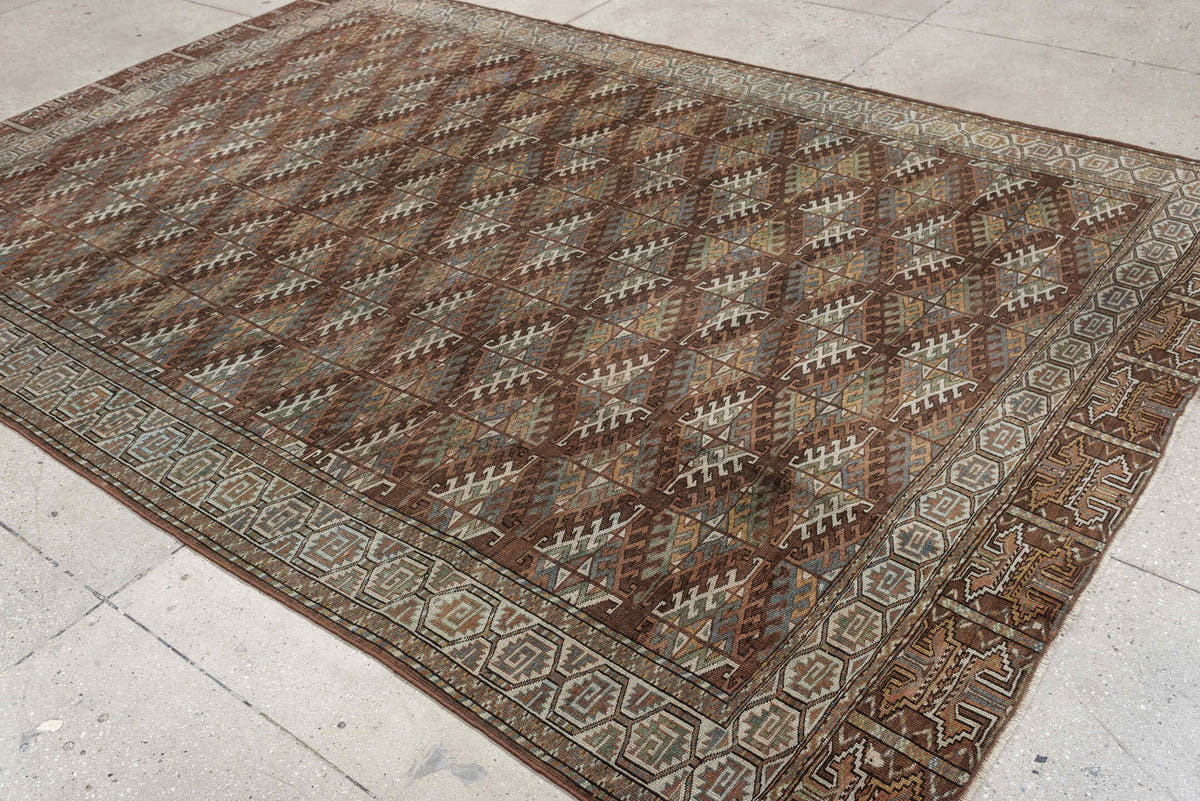 7' x 10' one-of-a-kind handmade antique Yamoud large size rug. Color palette: brown, camel, ivory, muted teal, rust, taupe