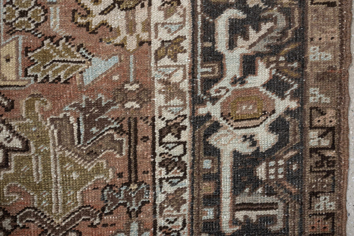 5' x 8' one-of-a-kind handmade antique Heriz medium size rug. Color palette: terra cotta, charcoal, ivory, olive, camel