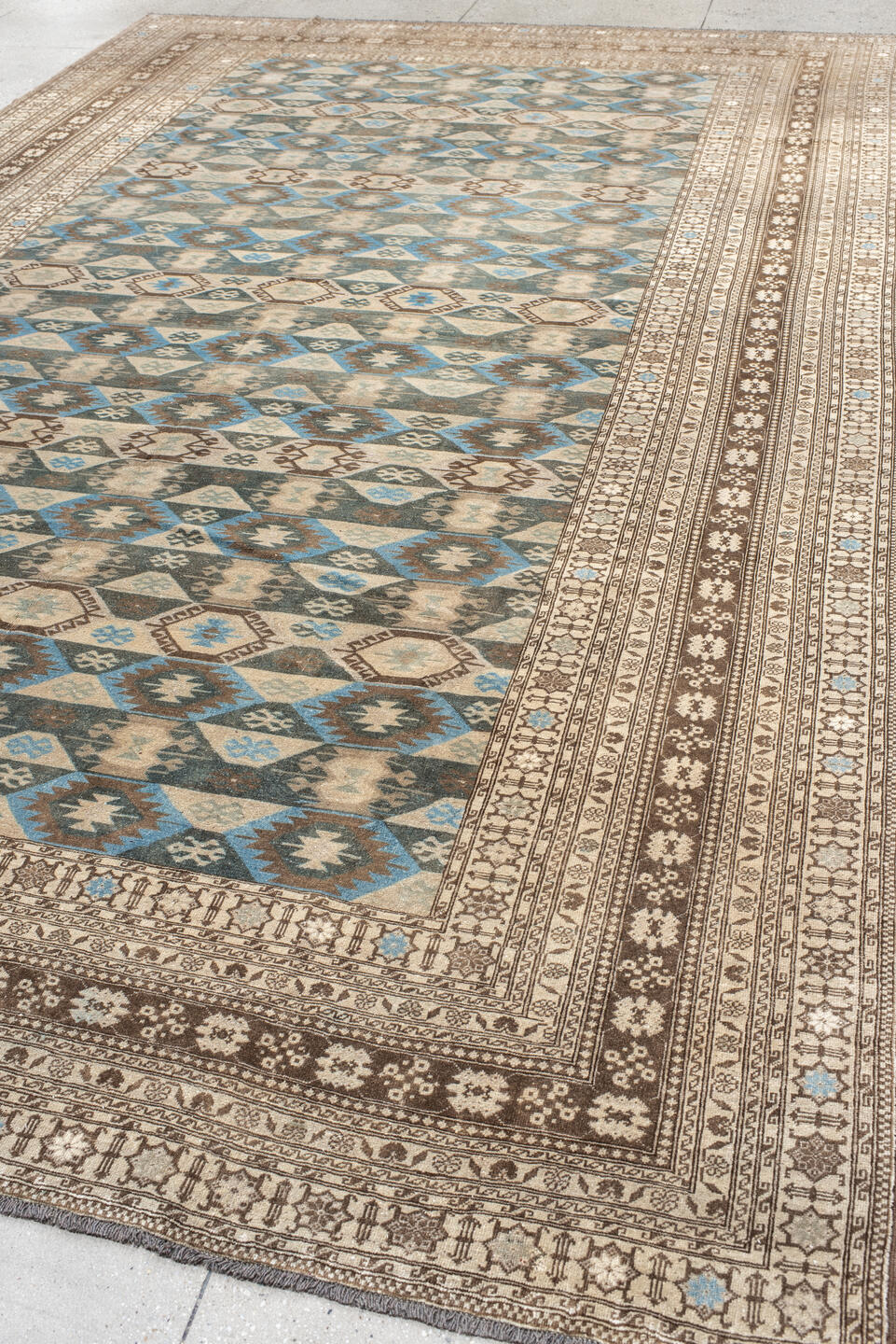 9' x 15' one-of-a-kind handmade vintage Afghan rug. Color palette: black, blue, brown, dim gray, gray, light gray, off-white