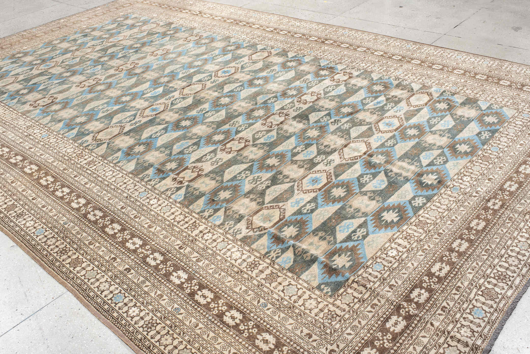 9' x 15' one-of-a-kind handmade vintage Afghan rug. Color palette: black, blue, brown, dim gray, gray, light gray, off-white