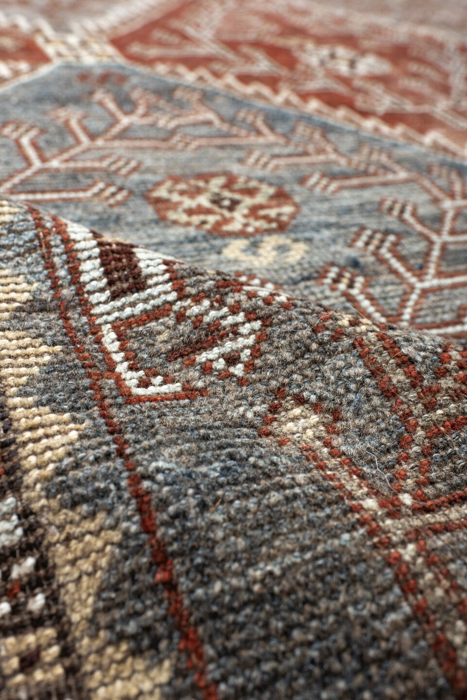 4' x 9' one-of-a-kind handmade antique Shiraz rug. Color palette: rust, sky blue, ivory, brown, taupe, charcoal, terracotta