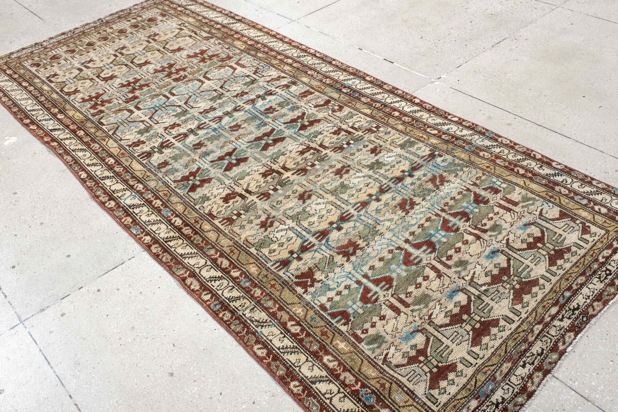 4' x 10' one-of-a-kind handmade vintage NW Persian runner rug. Color palette: ivory, rust, sky_blue, sage, taupe, brown