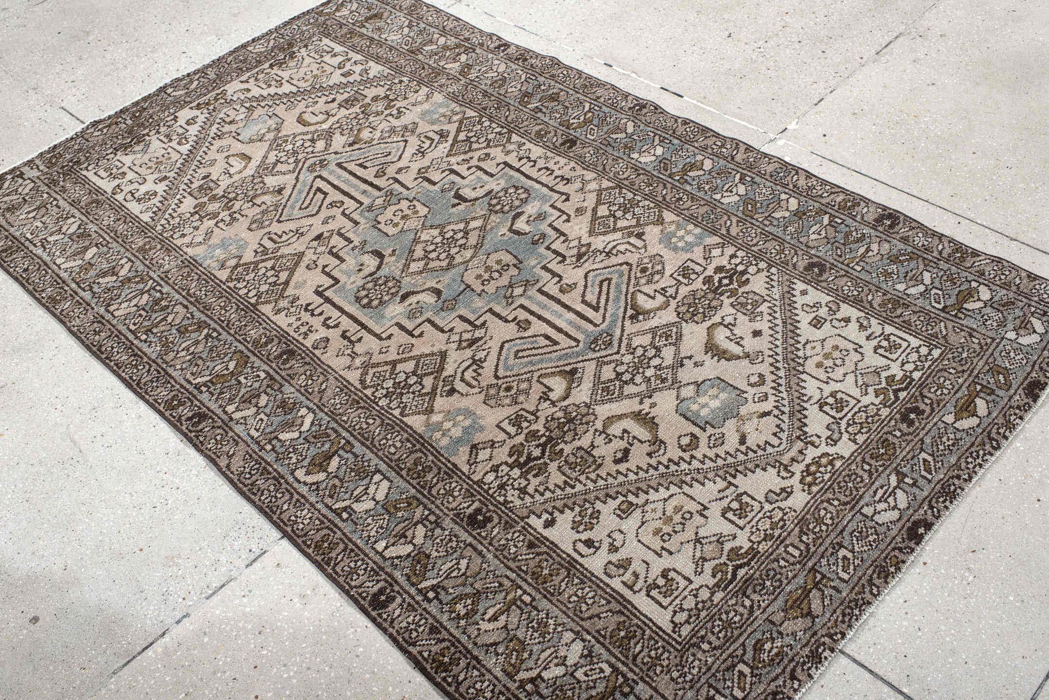 4' x 6' one-of-a-kind handmade vintage Heriz small size rug. Color palette: ivory, taupe, sky_blue, brown, charcoal, camel