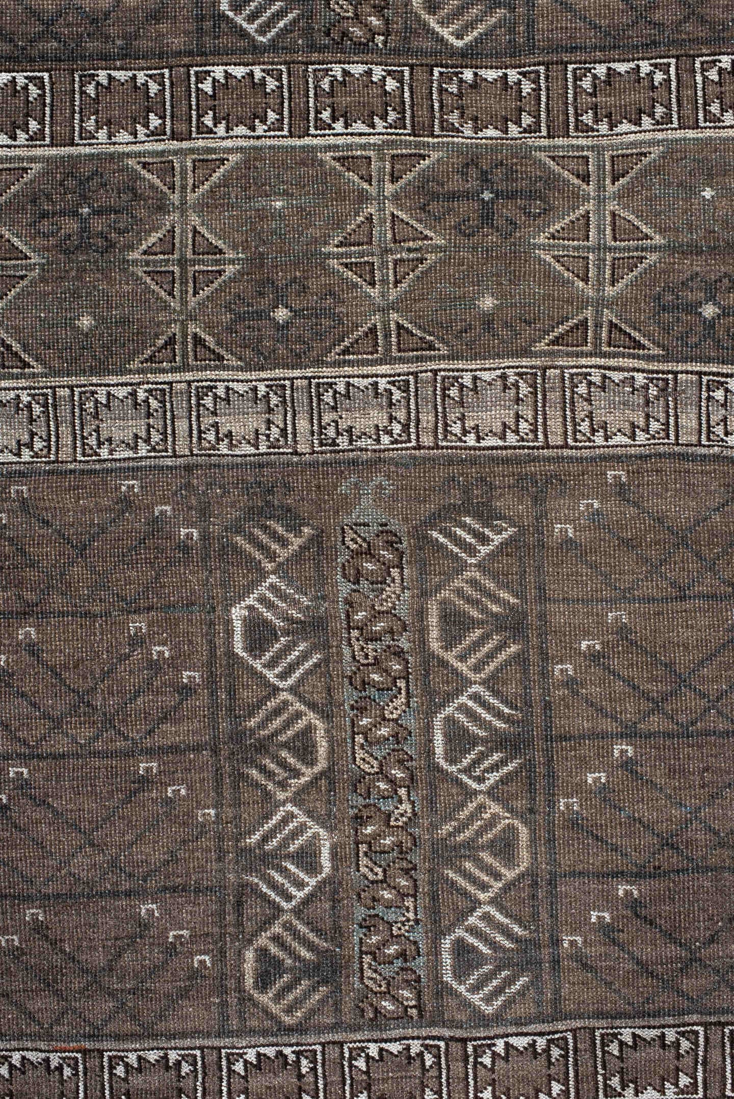 4' x 6' one-of-a-kind handmade vintage Belouch small size rug. Color palette: taupe, brown, ivory, charcoal, camel, slate