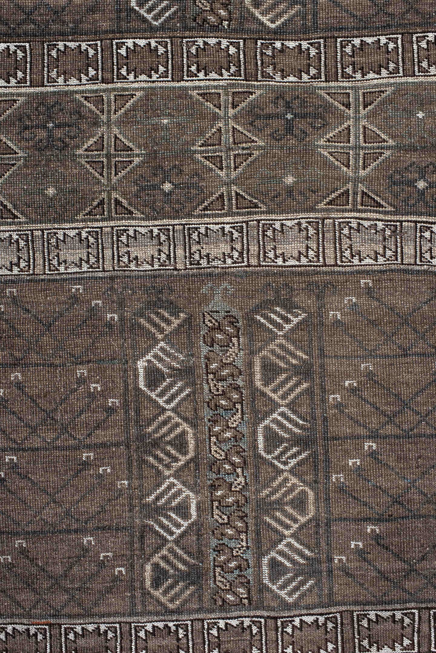 4' x 6' one-of-a-kind handmade vintage Belouch small size rug. Color palette: taupe, brown, ivory, charcoal, camel, slate