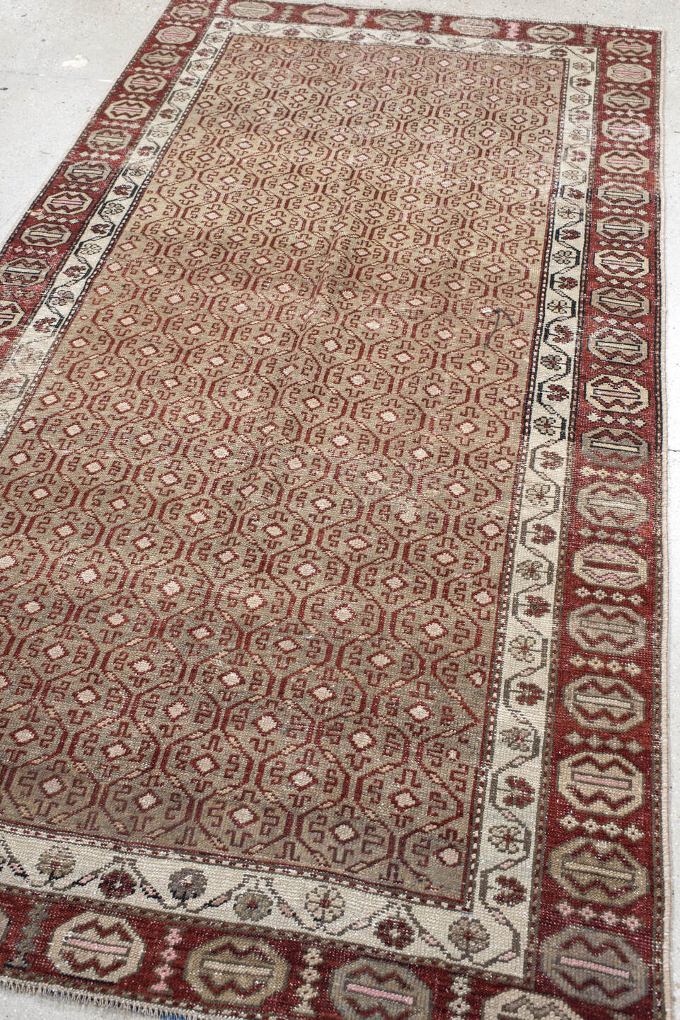 4' x 7' one-of-a-kind handmade vintage Anatol rug. Color palette: black, brown, gray, light gray, off-white, pink, red