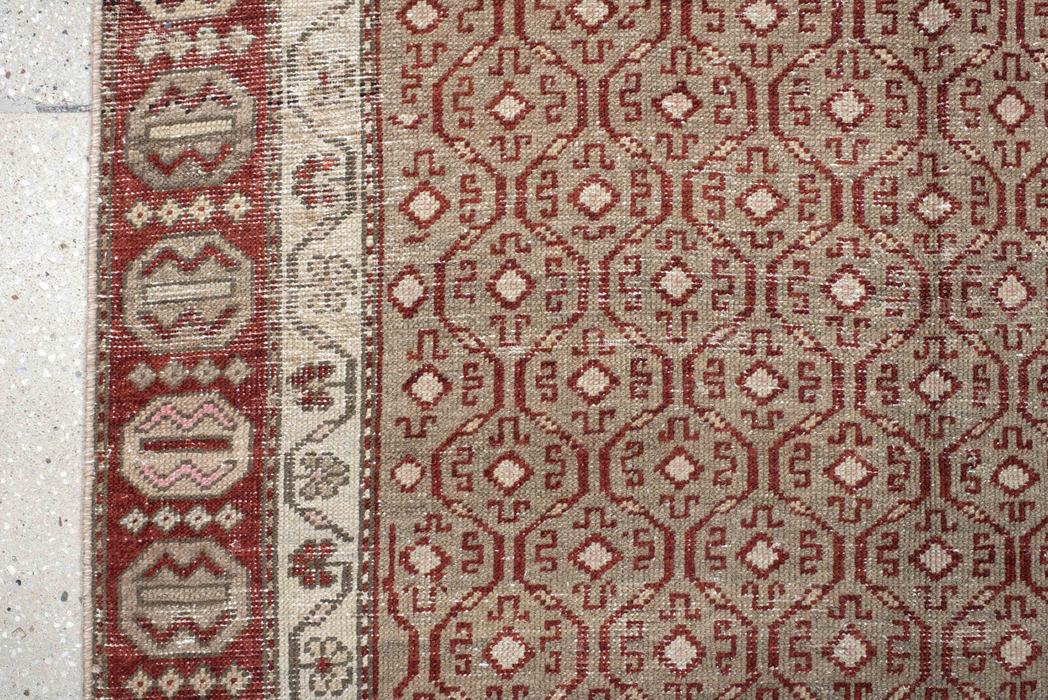 4' x 7' one-of-a-kind handmade vintage Anatol rug. Color palette: black, brown, gray, light gray, off-white, pink, red