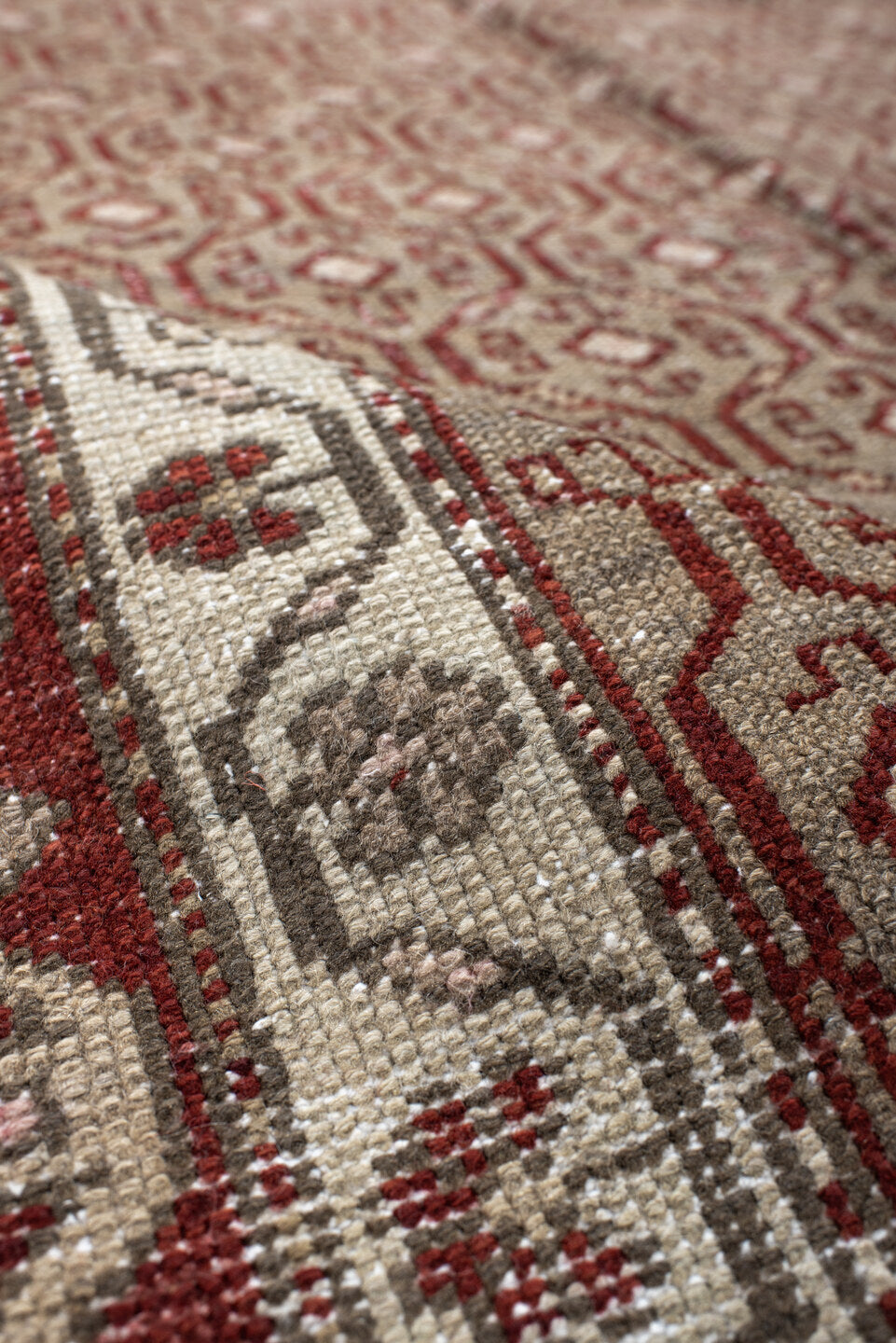 4' x 7' one-of-a-kind handmade vintage Anatol rug. Color palette: black, brown, gray, light gray, off-white, pink, red