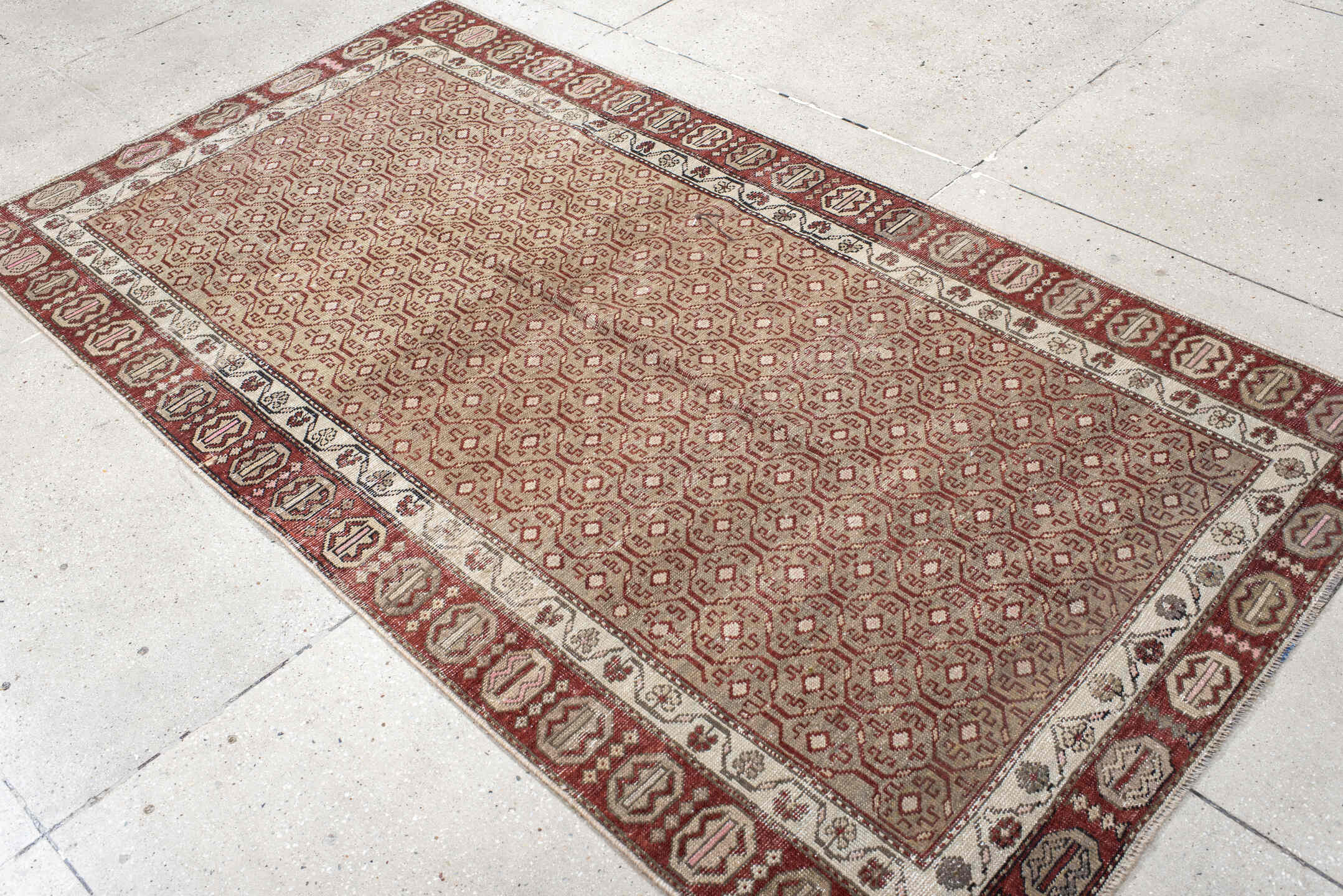 4' x 7' one-of-a-kind handmade vintage Anatol rug. Color palette: black, brown, gray, light gray, off-white, pink, red