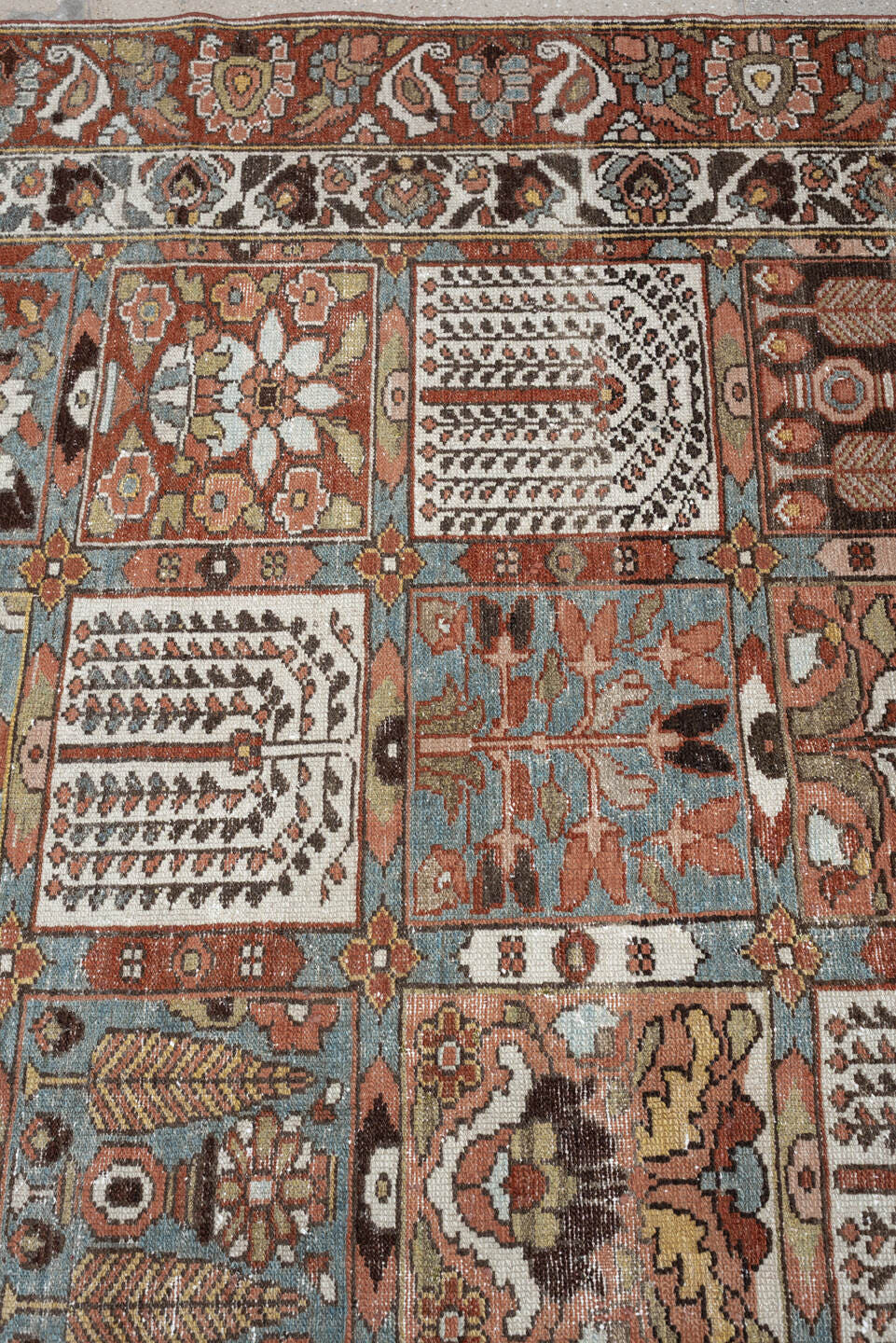 6' x 9' one-of-a-kind handmade antique Baktiary large size rug. Color palette: terracotta, ivory, blue gray, rust, brown