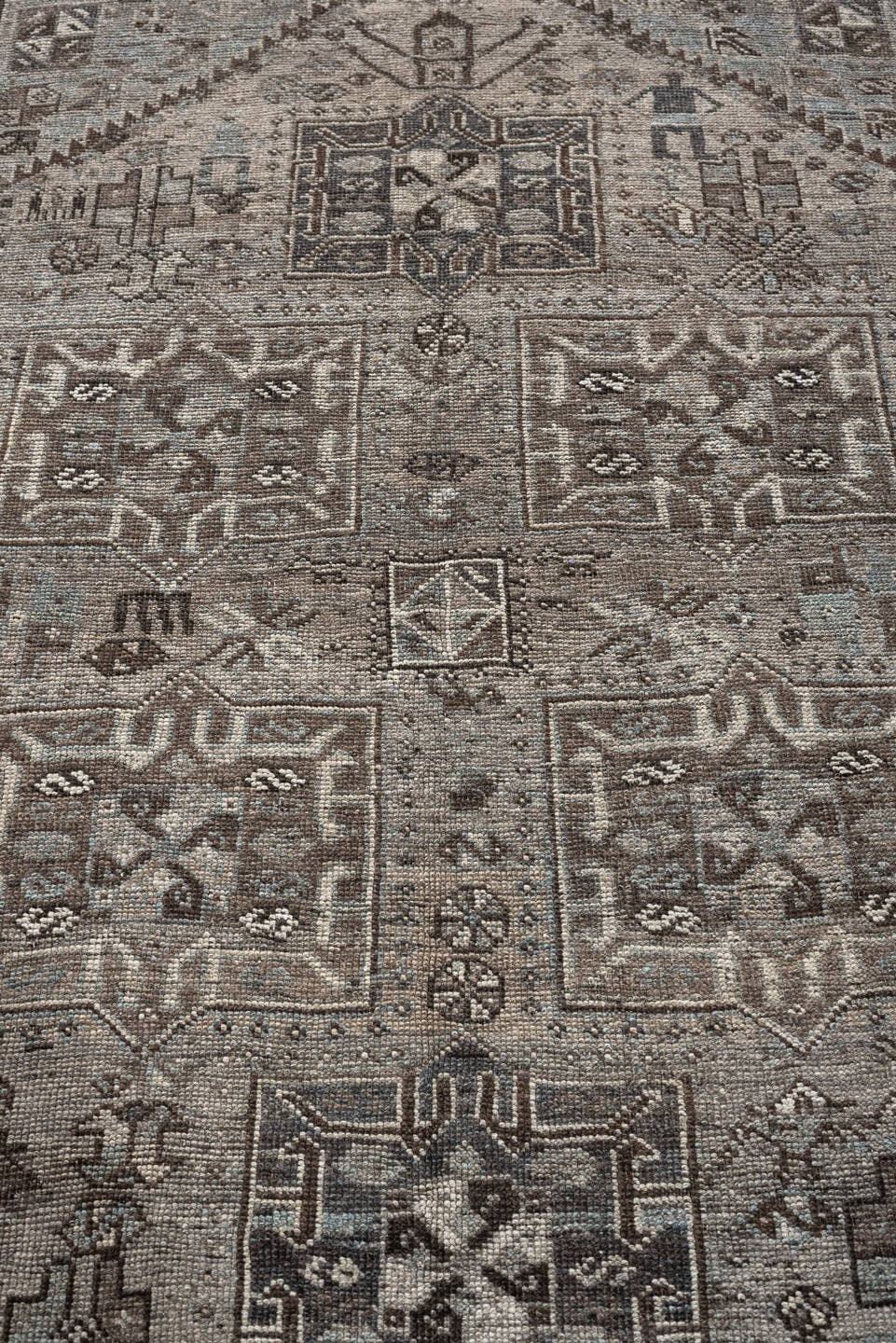 5' x 7' one-of-a-kind handmade antique Shiraz rug. Color palette: ivory, blue gray, taupe, brown, charcoal, sage, ochre