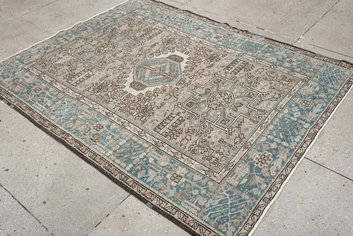 4' x 6' one-of-a-kind handmade antique Karaje rug. Color palette: ivory, powder blue, taupe, charcoal, brown, slate, cream